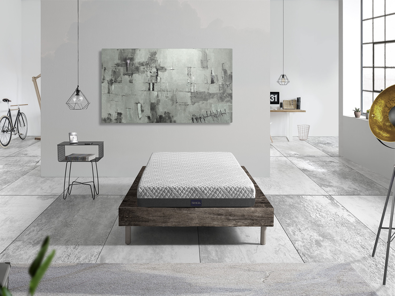 Una cama blanca con colchón en una habitación moderna con obras de arte.