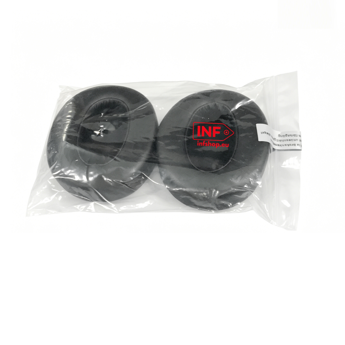 Deux coussinets d'oreille noirs en emballage plastique, avec logo.