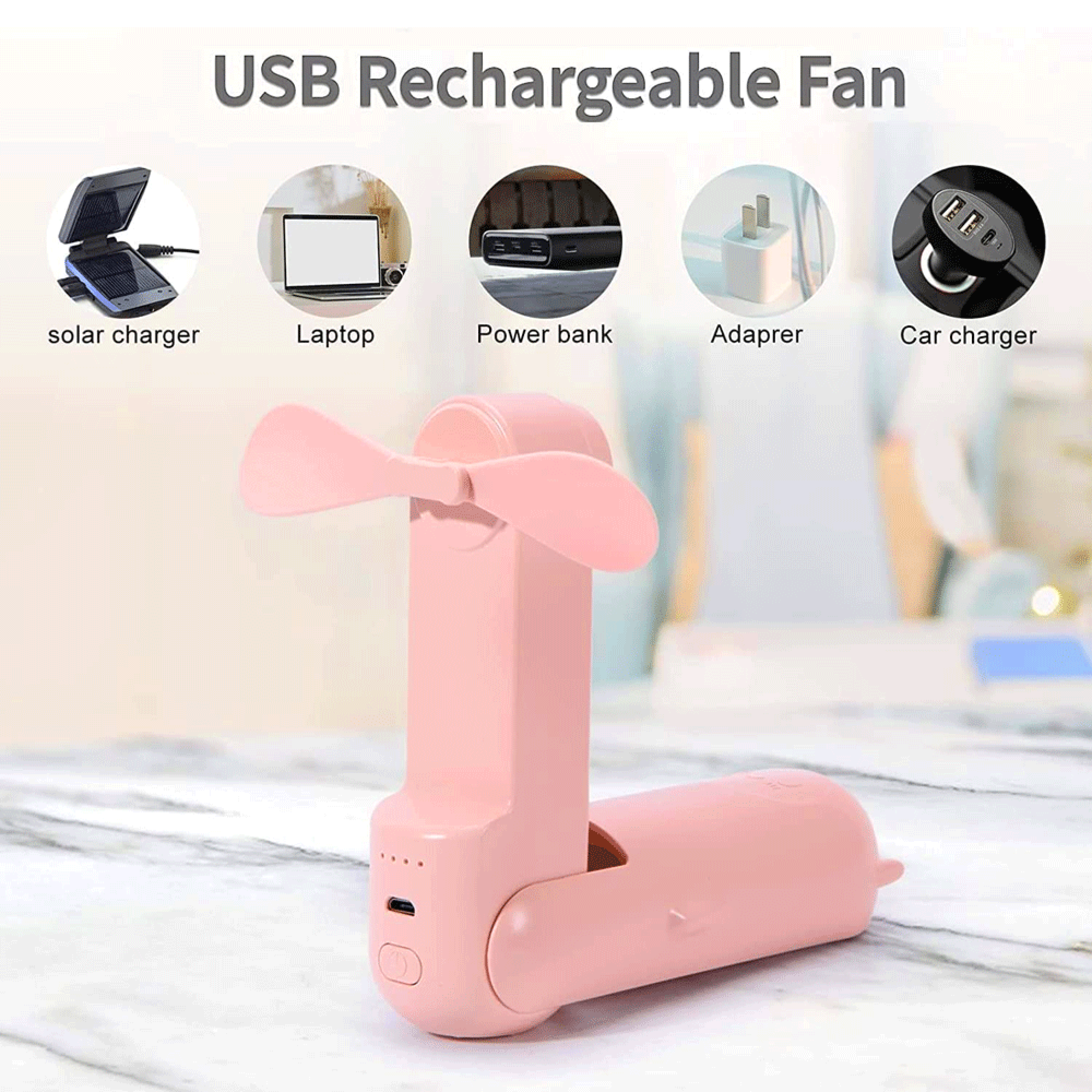 Ein kleiner rosa Ventilator mit zwei Flügeln, der über USB aufgeladen wird.