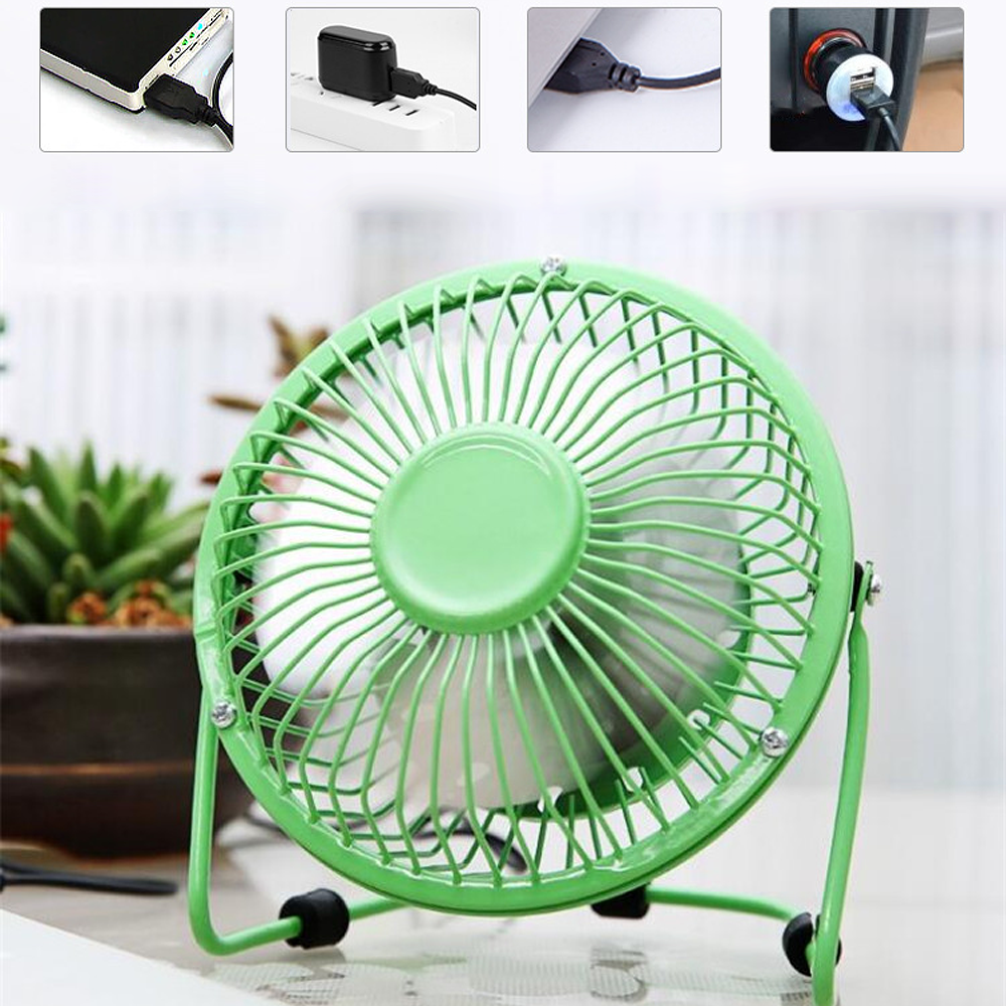 Ein kleiner grüner Ventilator steht auf einem Tisch neben einer Topfpflanze.