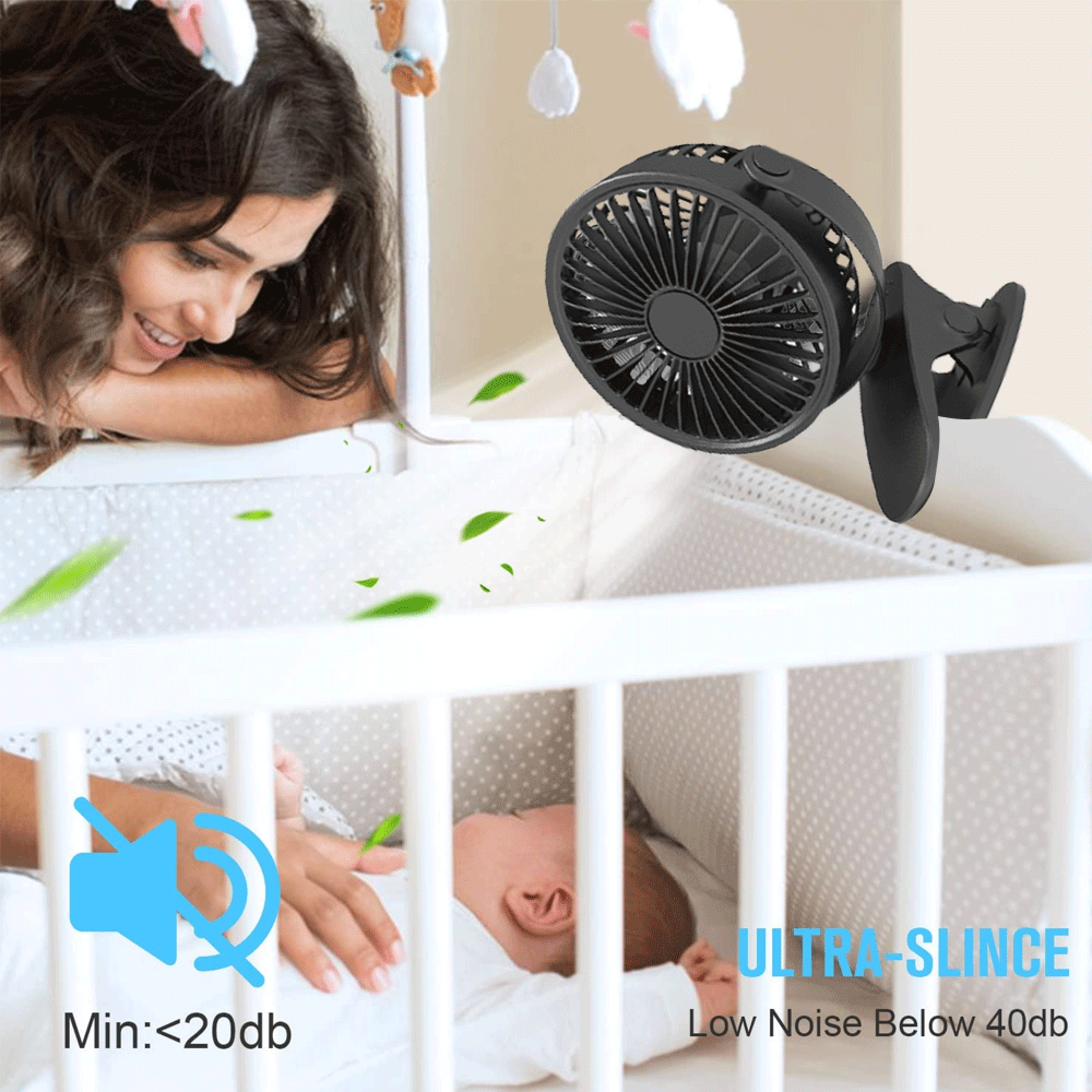 Eine Frau schaut auf ein Baby in einem Bett, ein Lüfter ist befestigt.