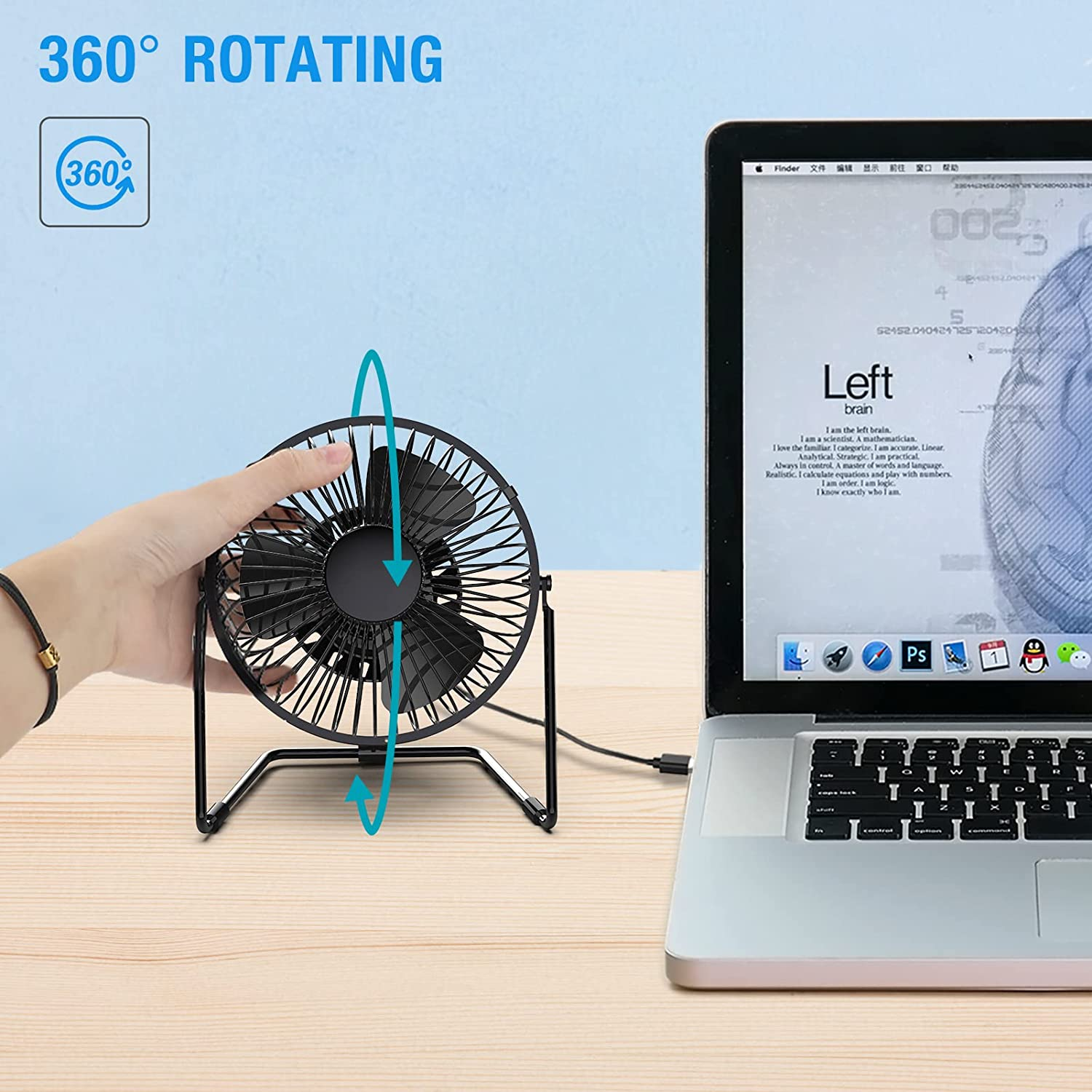 Ein schwarzer Tischventilator wird von einer Hand gehalten, daneben ein Laptop.