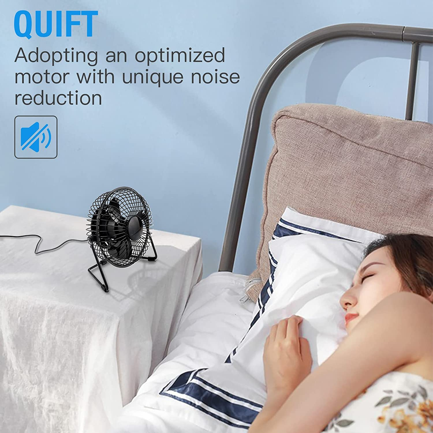 Ein kleiner schwarzer Ventilator steht auf einem Nachttisch neben einem schlafenden Mädchen.