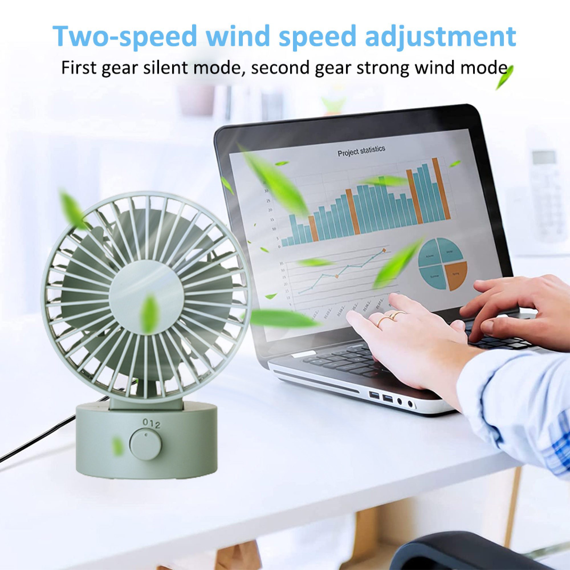 Ein kleiner Ventilator steht neben einem Laptop, auf dessen Bildschirm Diagramme angezeigt werden.