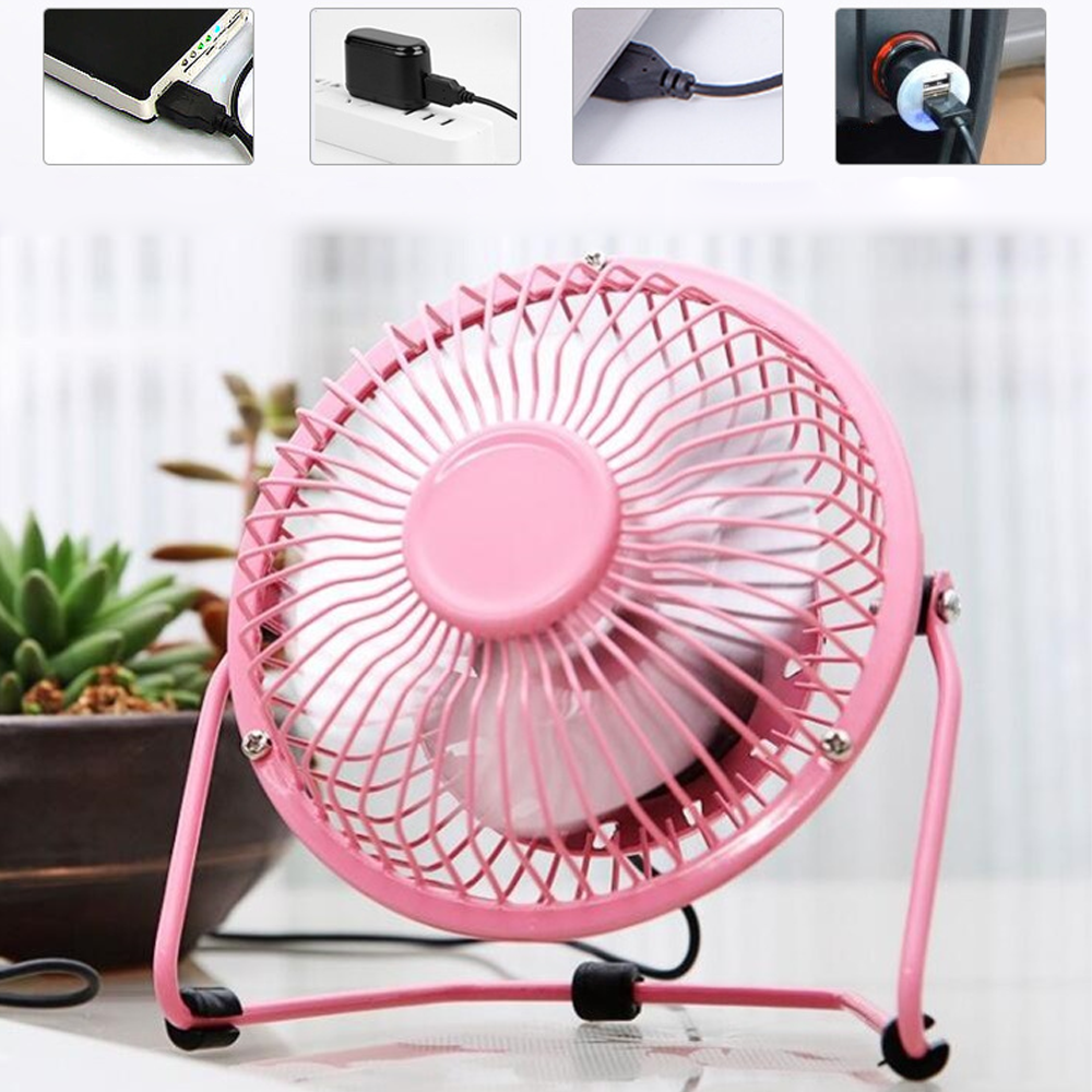 Ein kleiner rosafarbener USB-Ventilator steht neben einer Topfpflanze.
