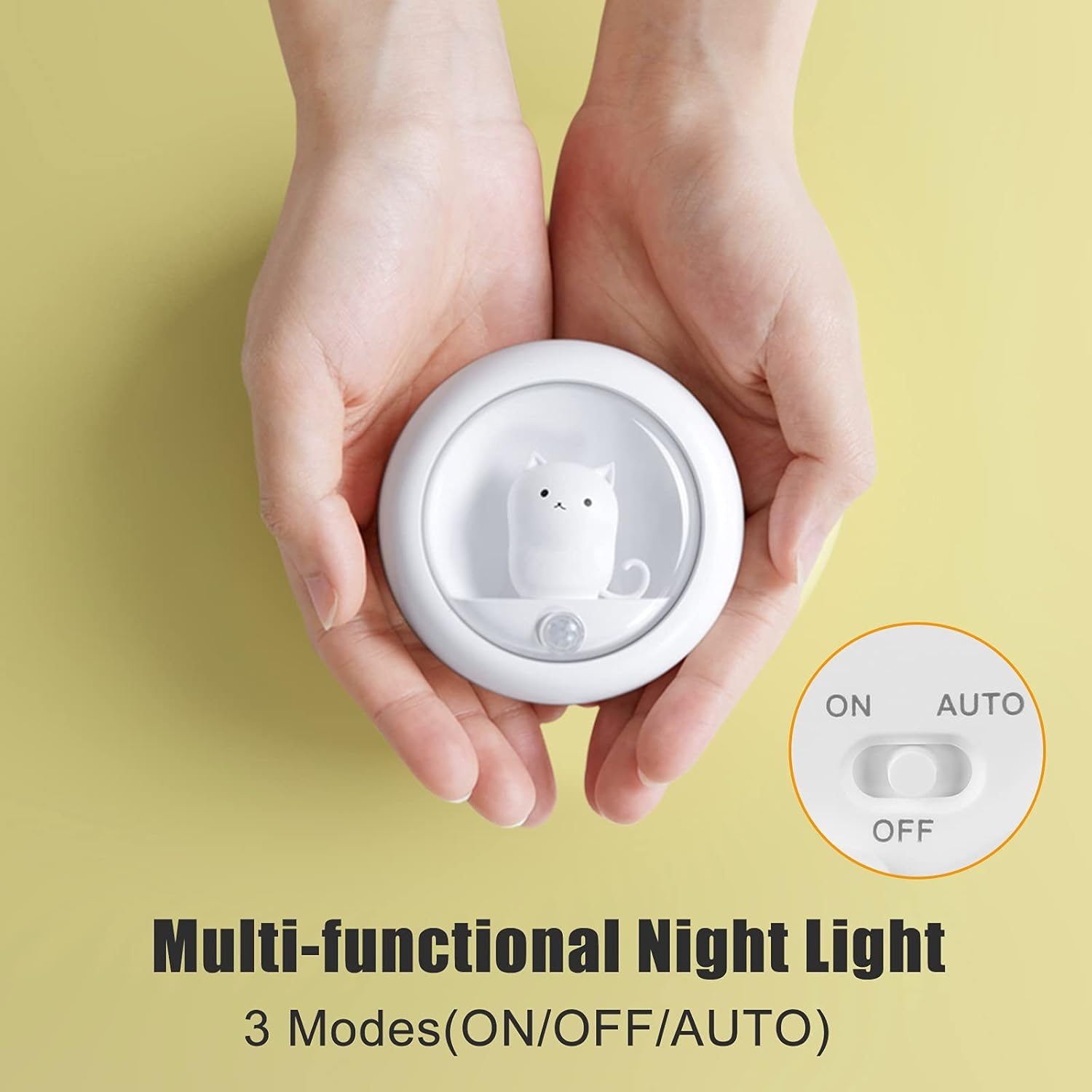 Weiße Nachttischlampe in Katzenform mit ON/OFF/AUTO-Schalter auf gelbem Hintergrund.