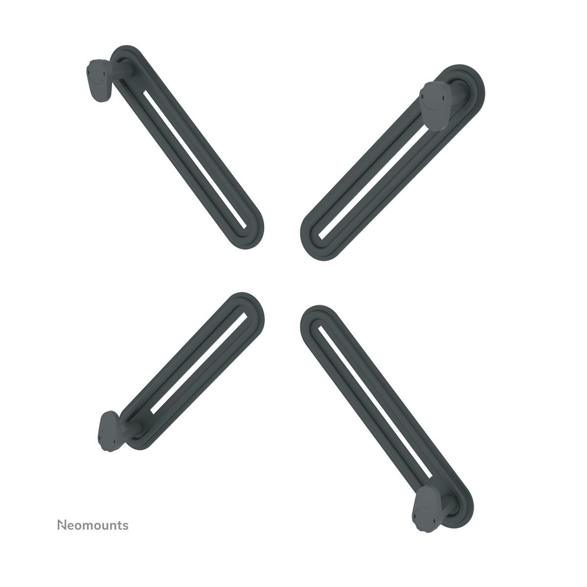 Four dark, oval mounts with slots and pegs, arranged pointing outwards from the center.