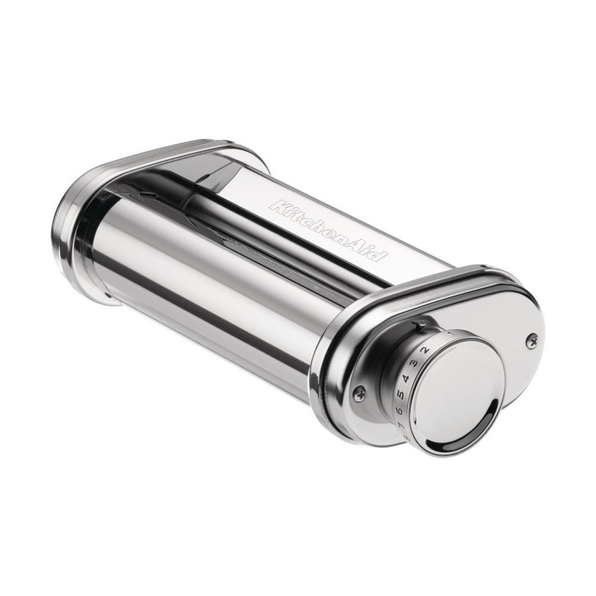 A shiny silver KitchenAid pasta attachment with an adjustment dial on the right side.