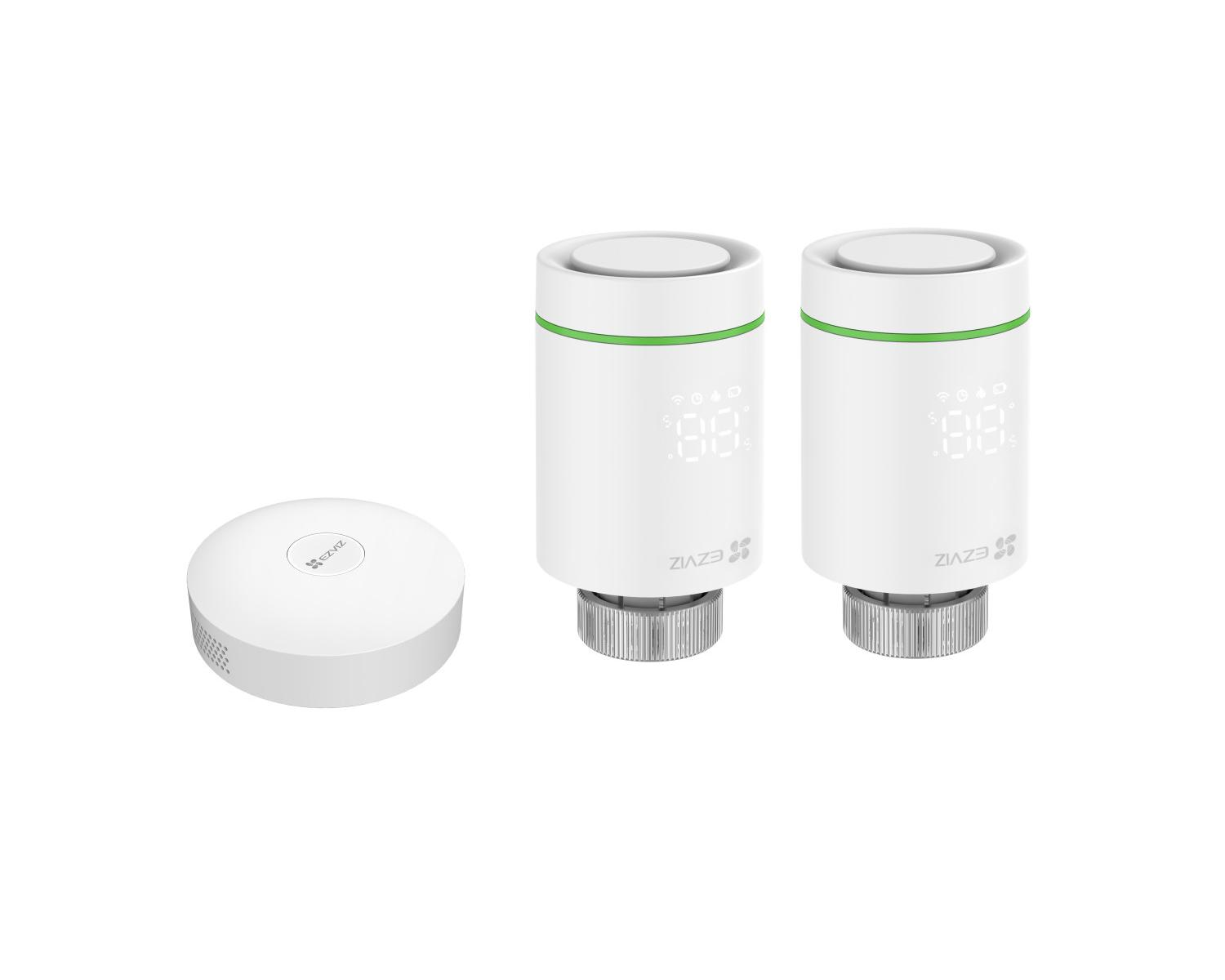 A white round hub and two white thermostat valves with screens.