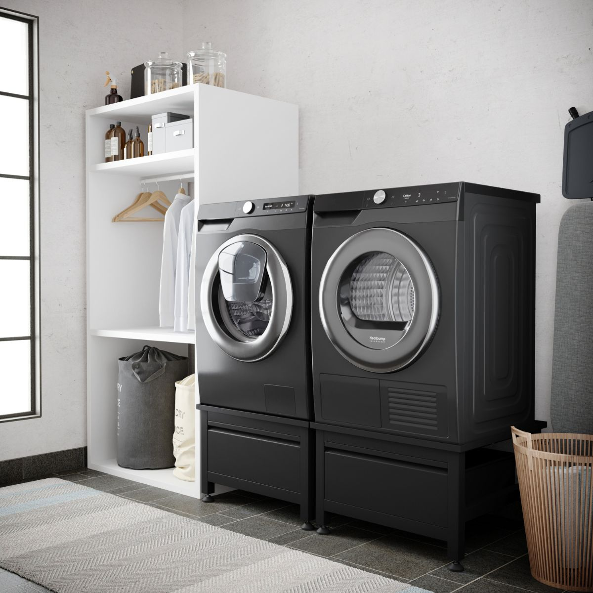 Laundry room with washing machine, dryer, shelving, and laundry baskets.