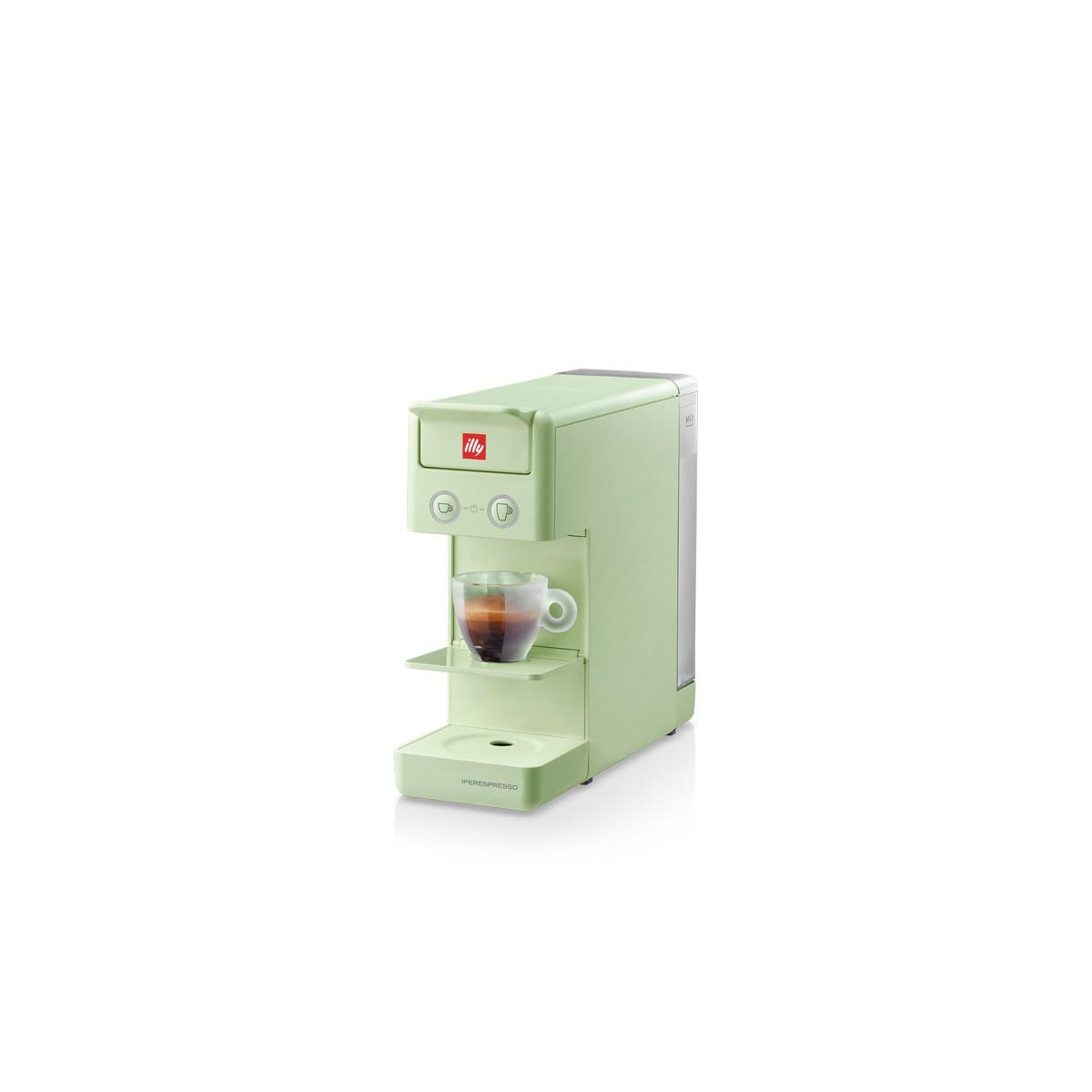 Una cafetera verde con una taza de espresso en preparación.