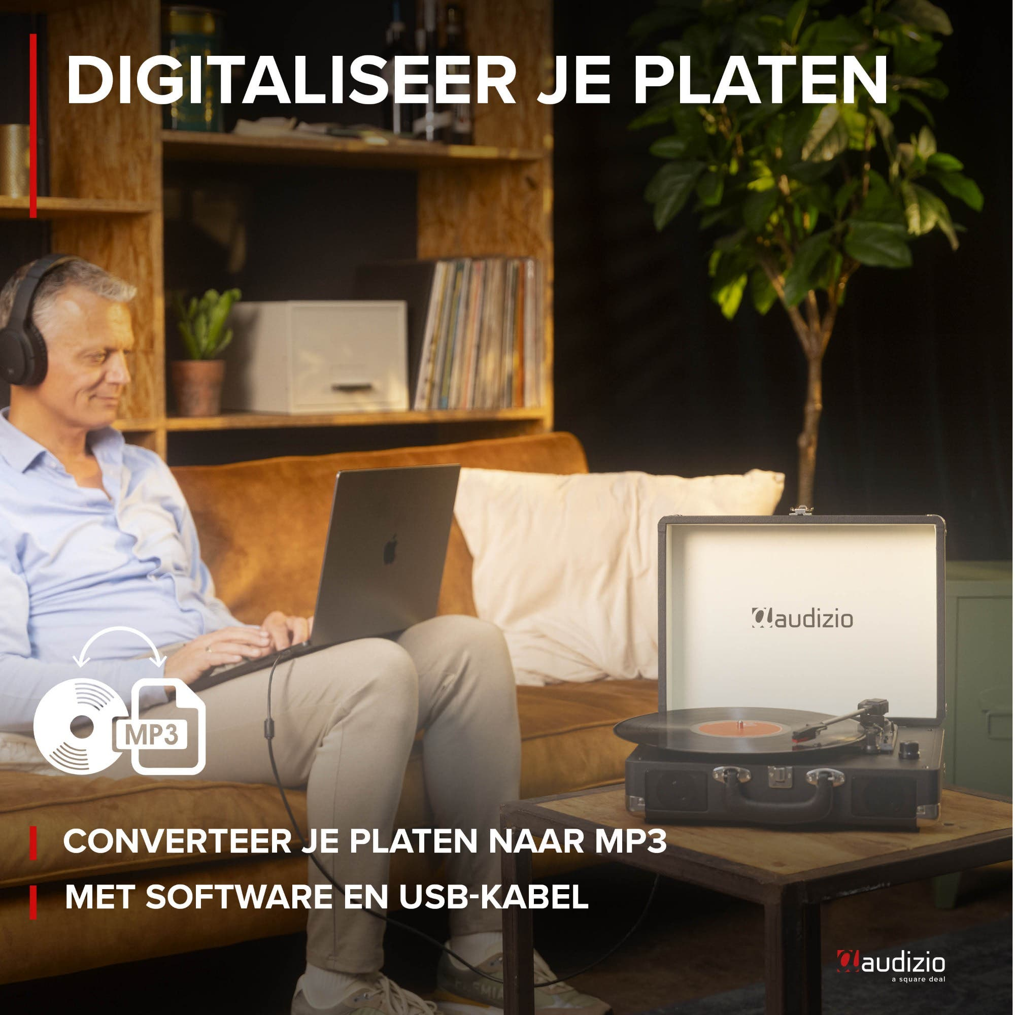 Hombre con auriculares digitaliza discos con portátil y tocadiscos.