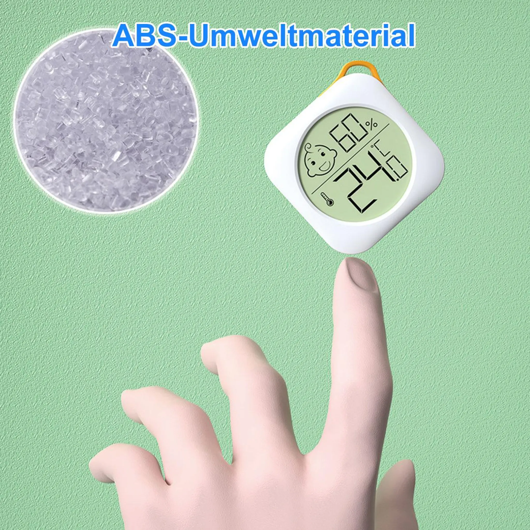 Ein Finger hält ein digitales Thermometer/Hygrometer mit Baby-Symbol und Anzeige 60% 24.6°C.