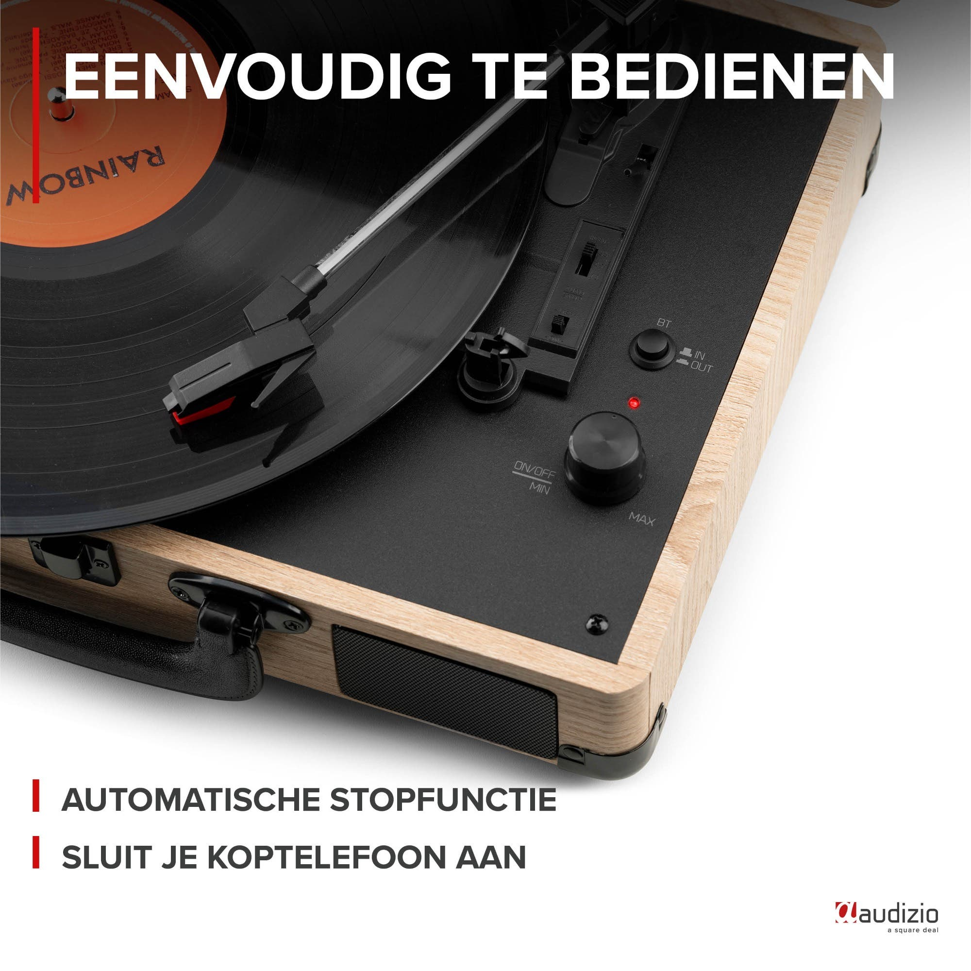 A wooden record player with controls plays a vinyl record. Easy to operate.