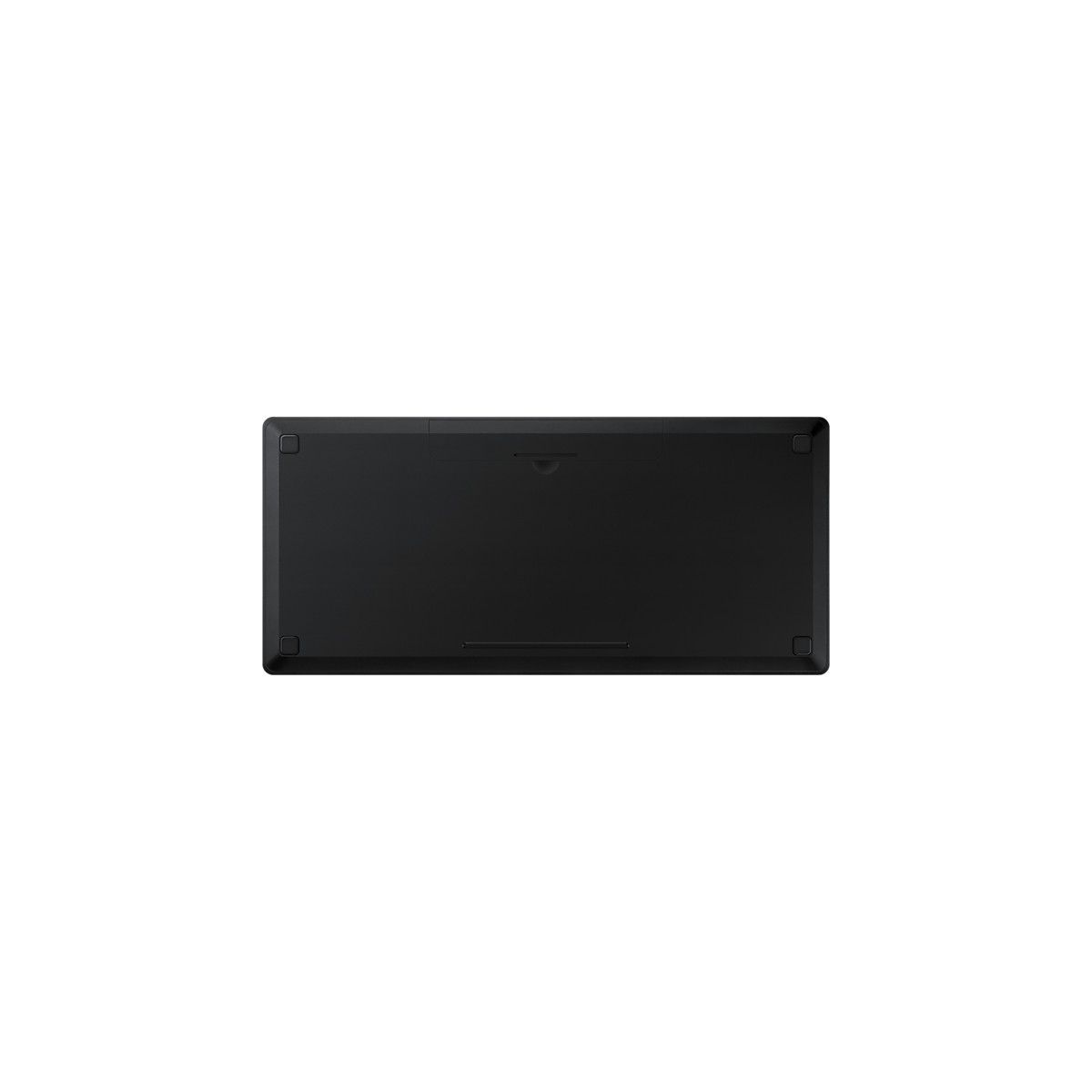 Un teclado negro, visto desde abajo, con cuatro pies en las esquinas y una ranura.