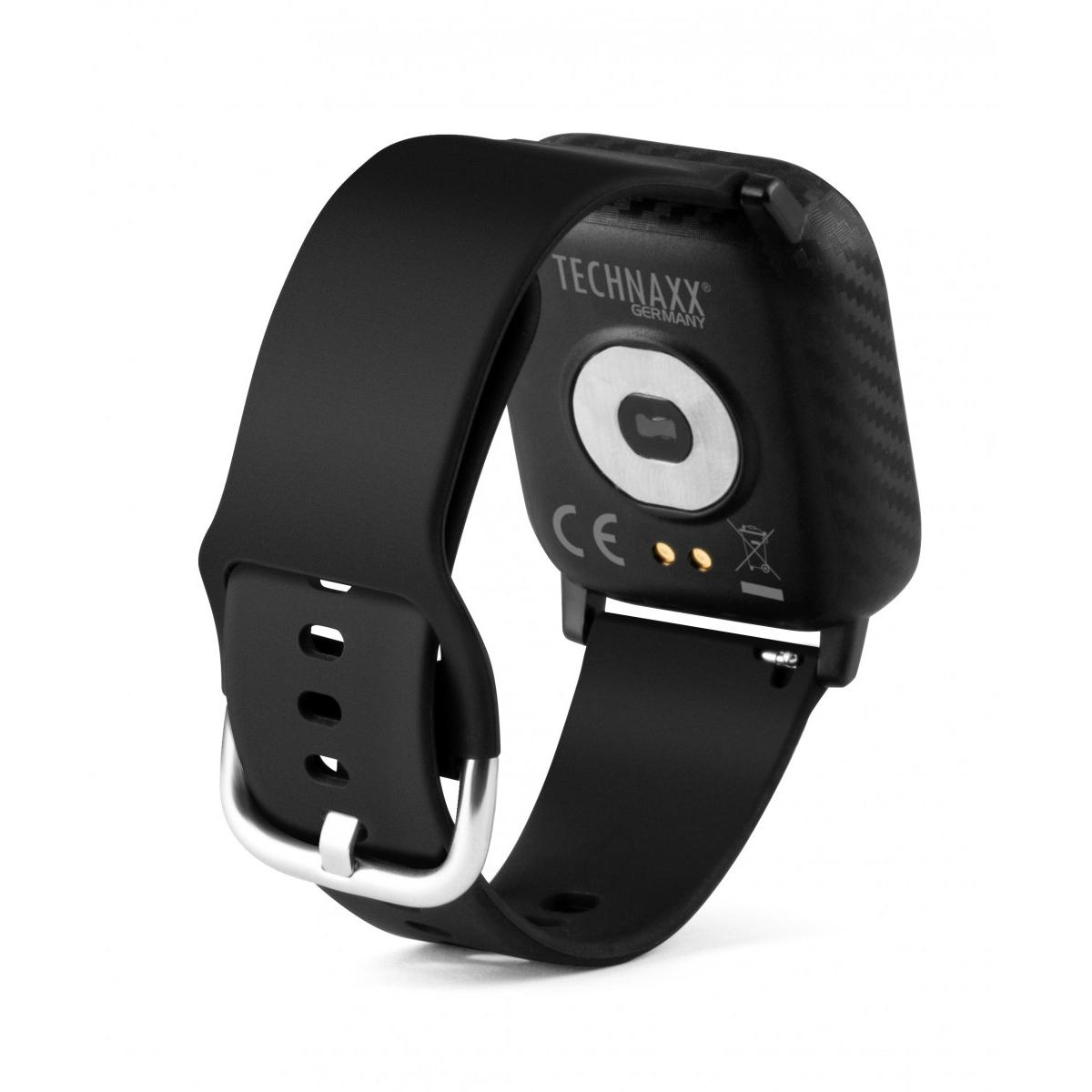 Smartwatch nero con fibbia in metallo e contatti di ricarica sul retro.