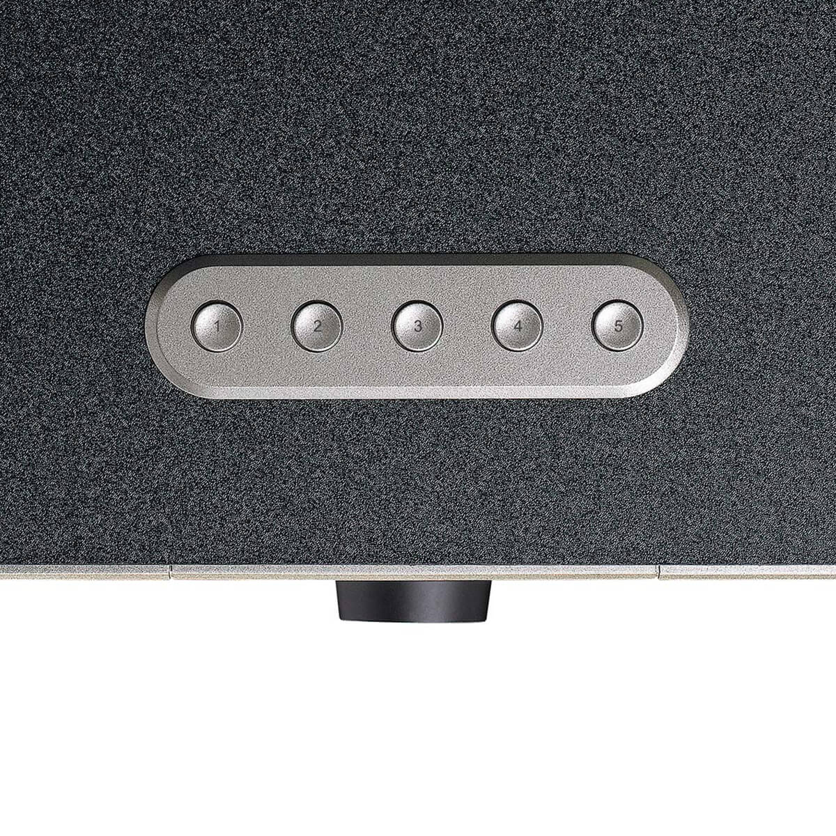 Five numbered buttons on a dark textured surface, with a black knob below.