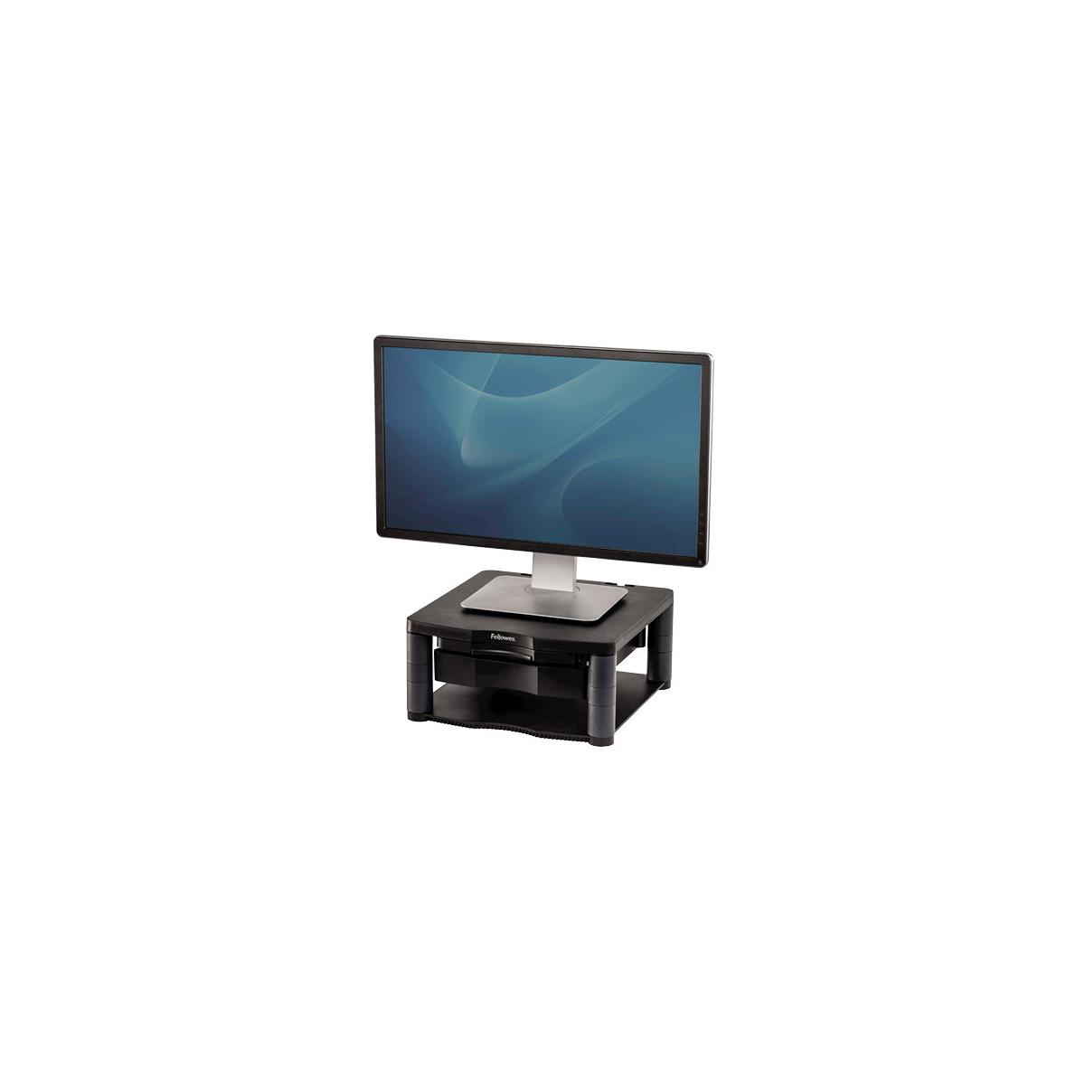 Un monitor se asienta sobre un soporte de monitor negro con cajones.