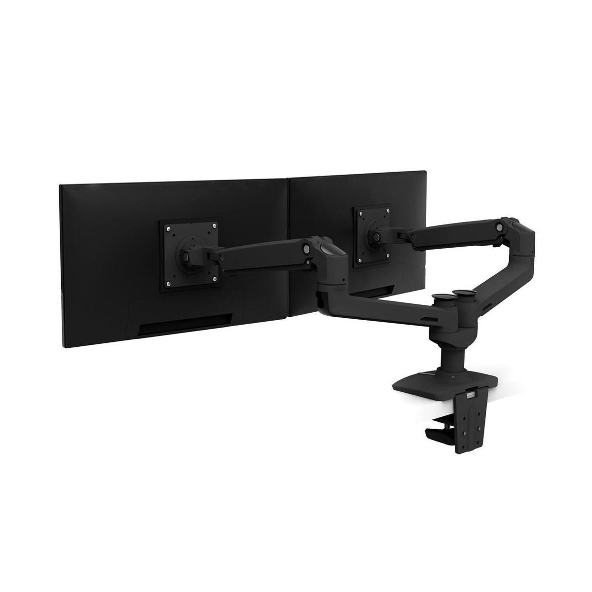 Black dual monitor arm holding two black monitors, clamped to a desk.