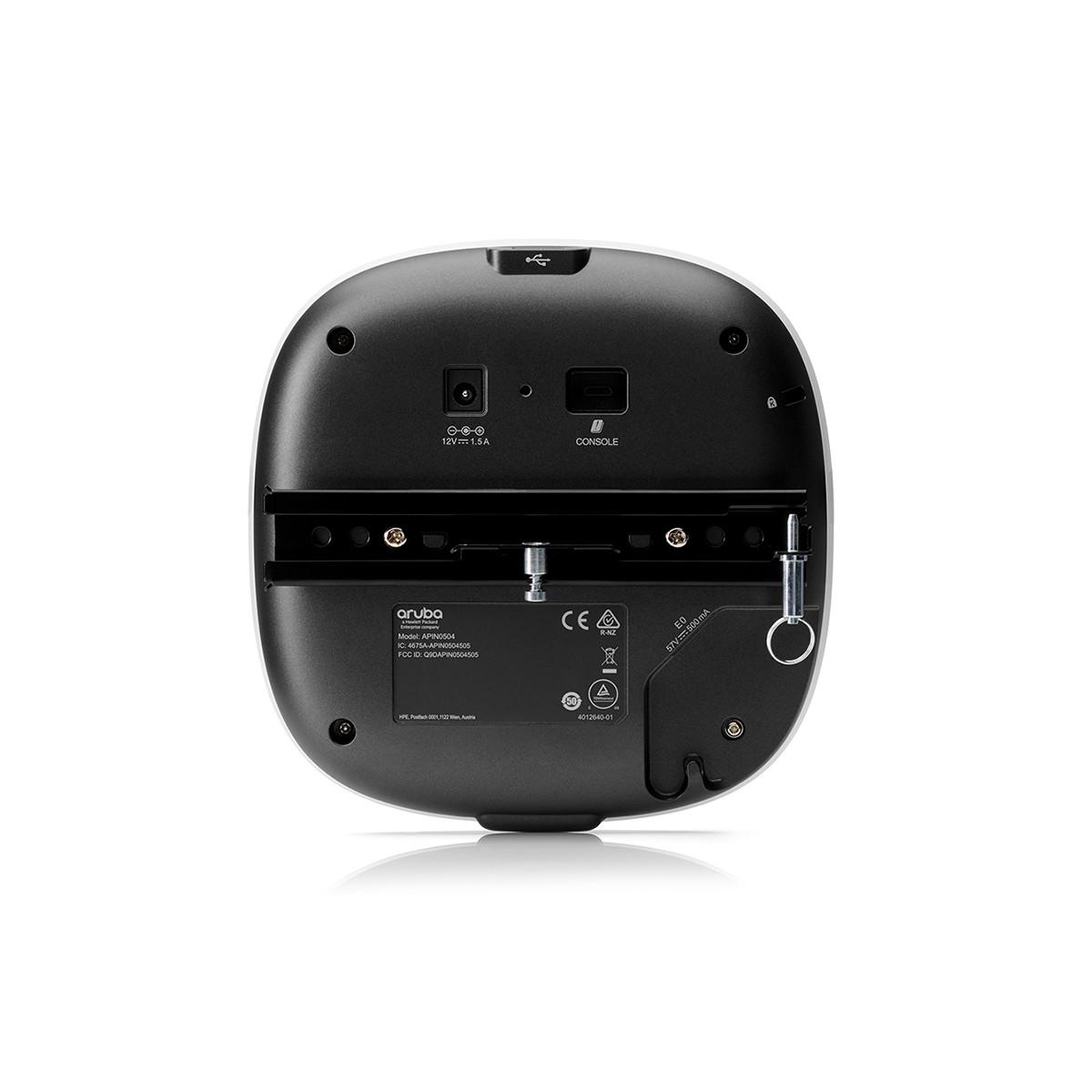 Vista posterior de un dispositivo Aruba blanco mostrando puertos: 12V 1.5A, consola, USB y etiqueta.