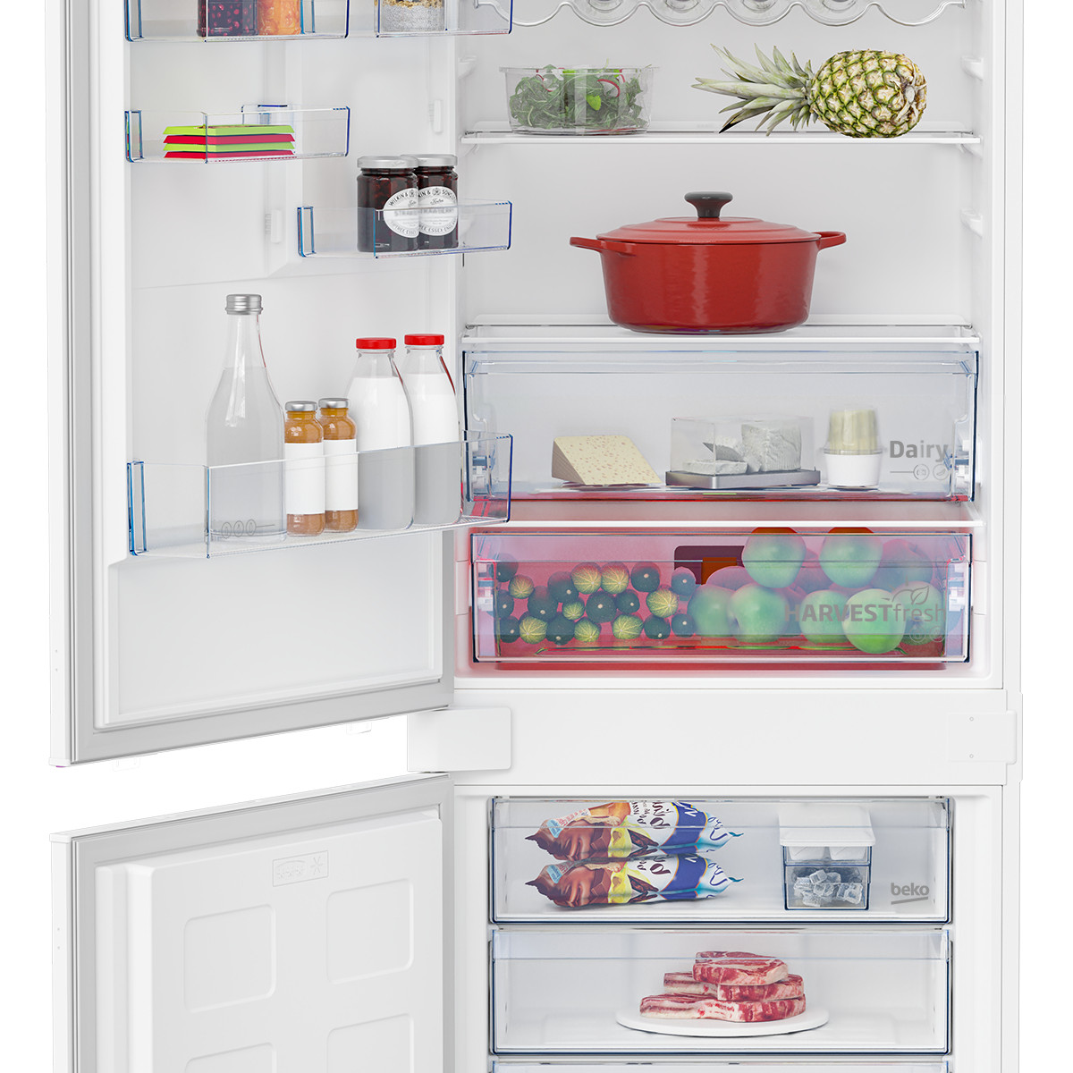 Interno del frigorifero con frutta, verdura, pentole, bottiglie e carne.
