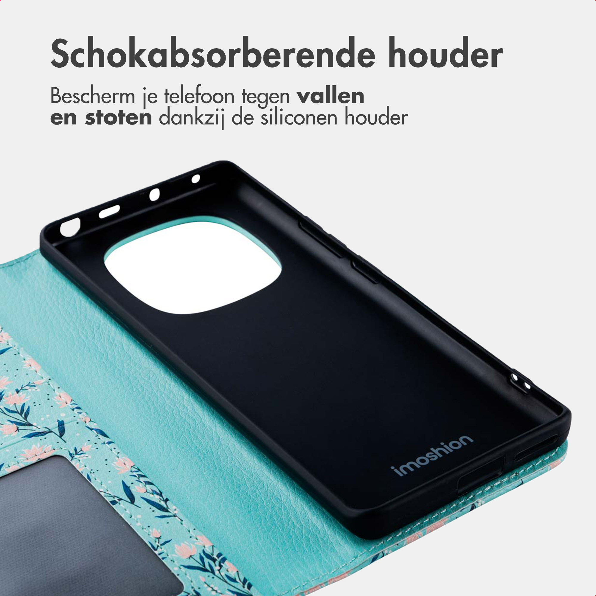 Zwarte siliconen telefoonhoes met bloemenpatroon op turquoise.