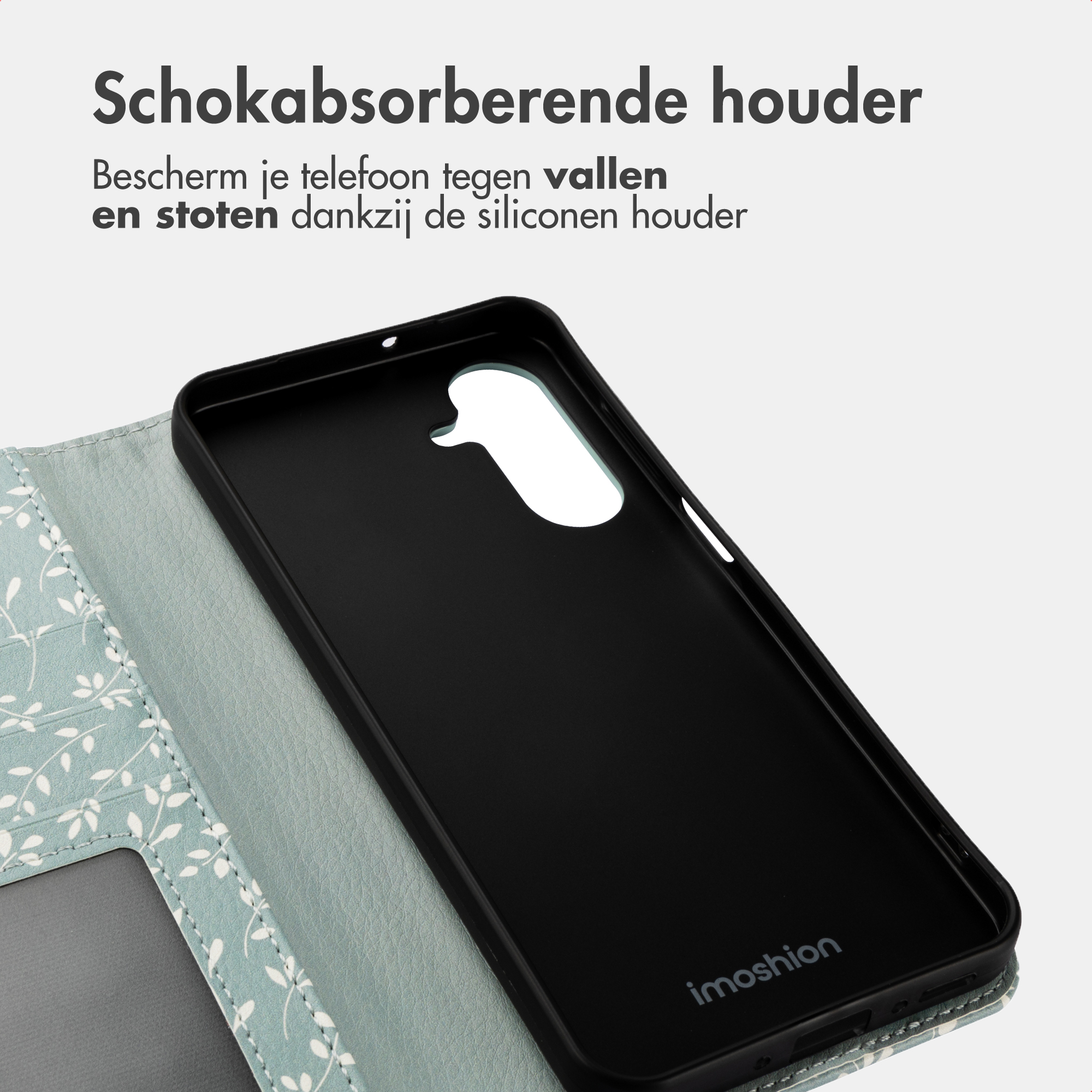 Een zwarte telefoonhoes met patroon en tekst. Schokabsorberend.