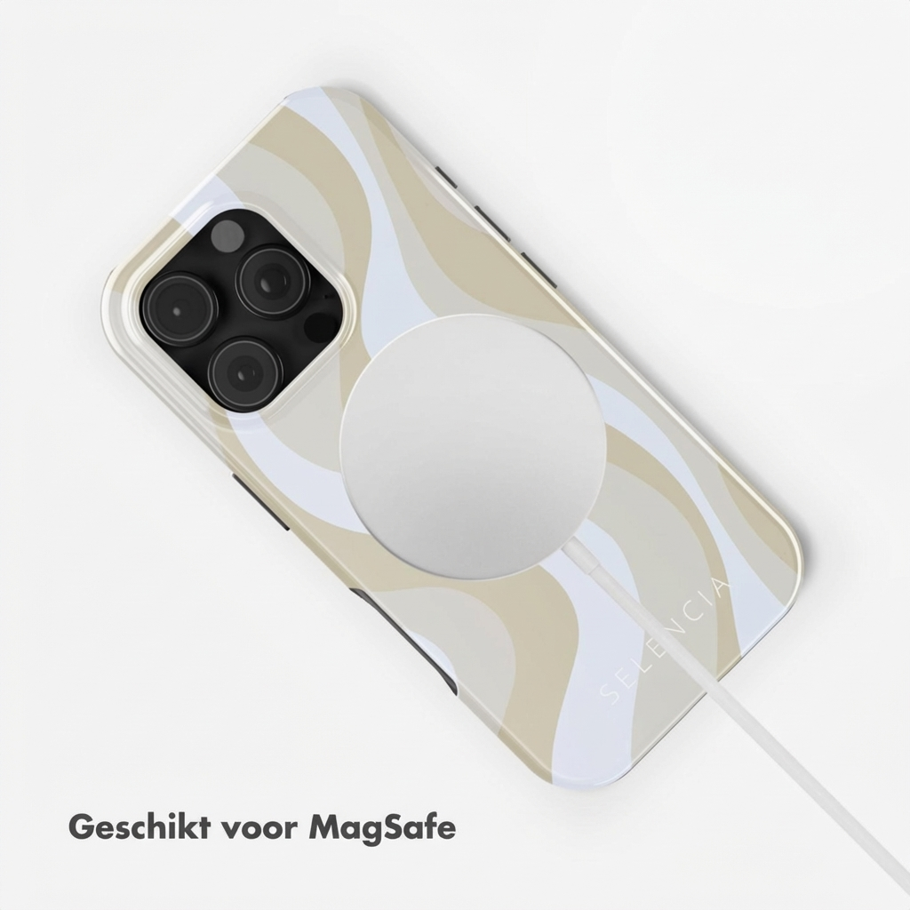 Un iPhone avec un motif ondulé beige et blanc, connecté à un chargeur MagSafe.