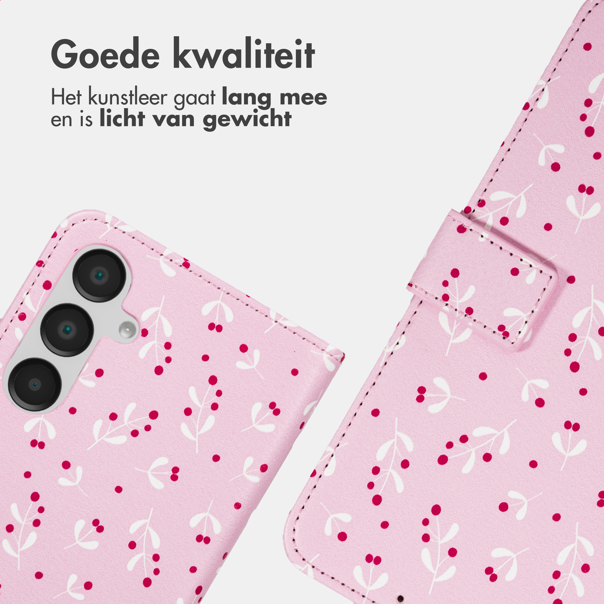Een roze telefoonhoes met een wit en rood patroon van bessen en bladeren.