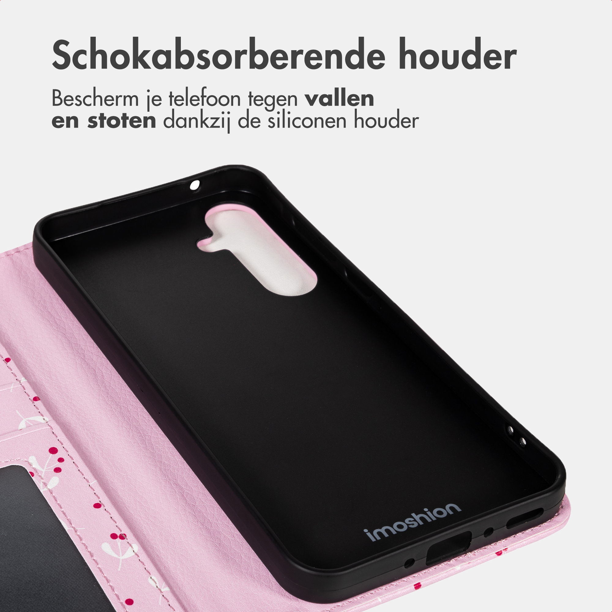 Een roze telefoonhoes met bloemenpatroon en zwart interieur.