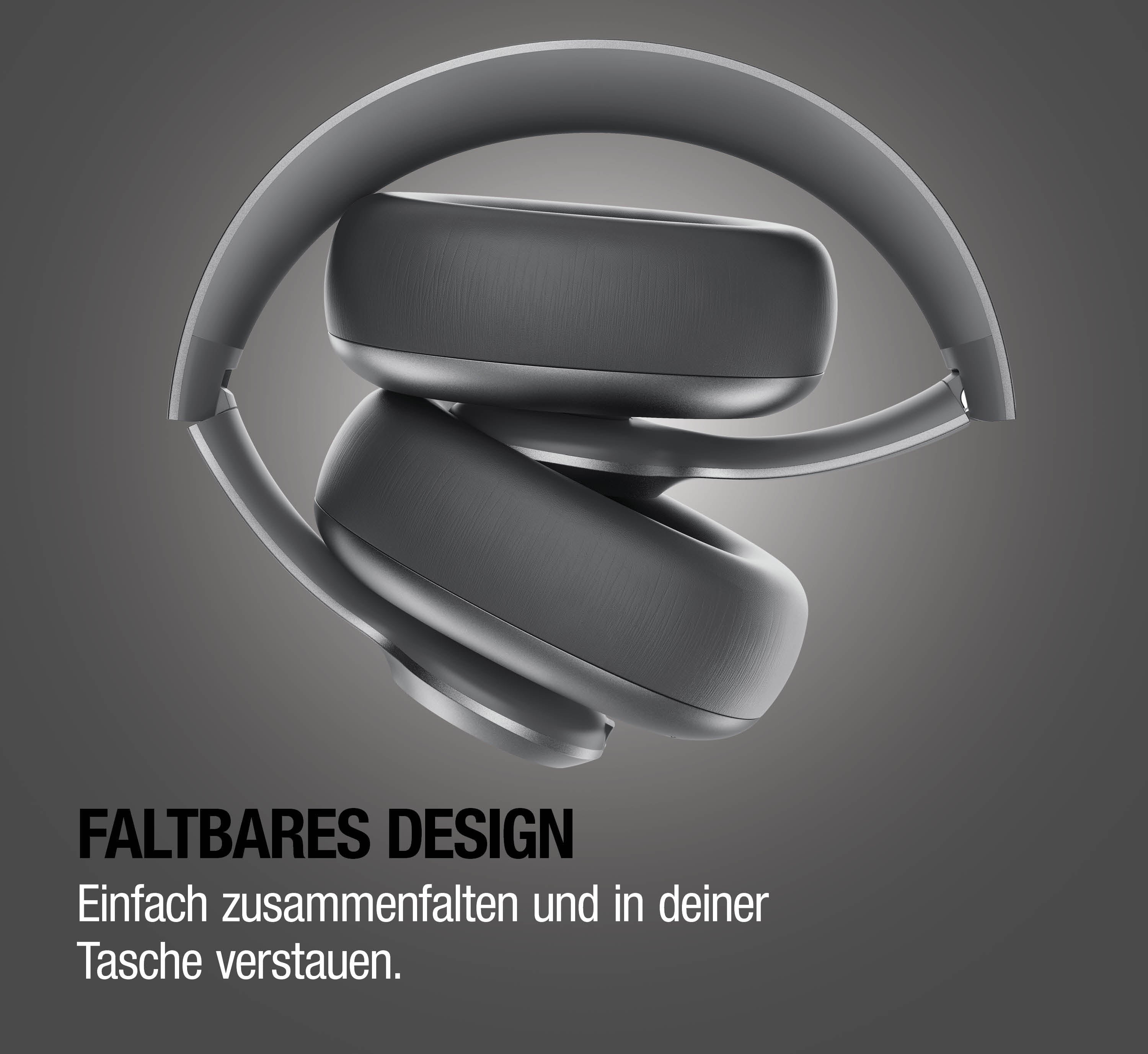 Graue, faltbare Kopfhörer auf grauem Hintergrund.