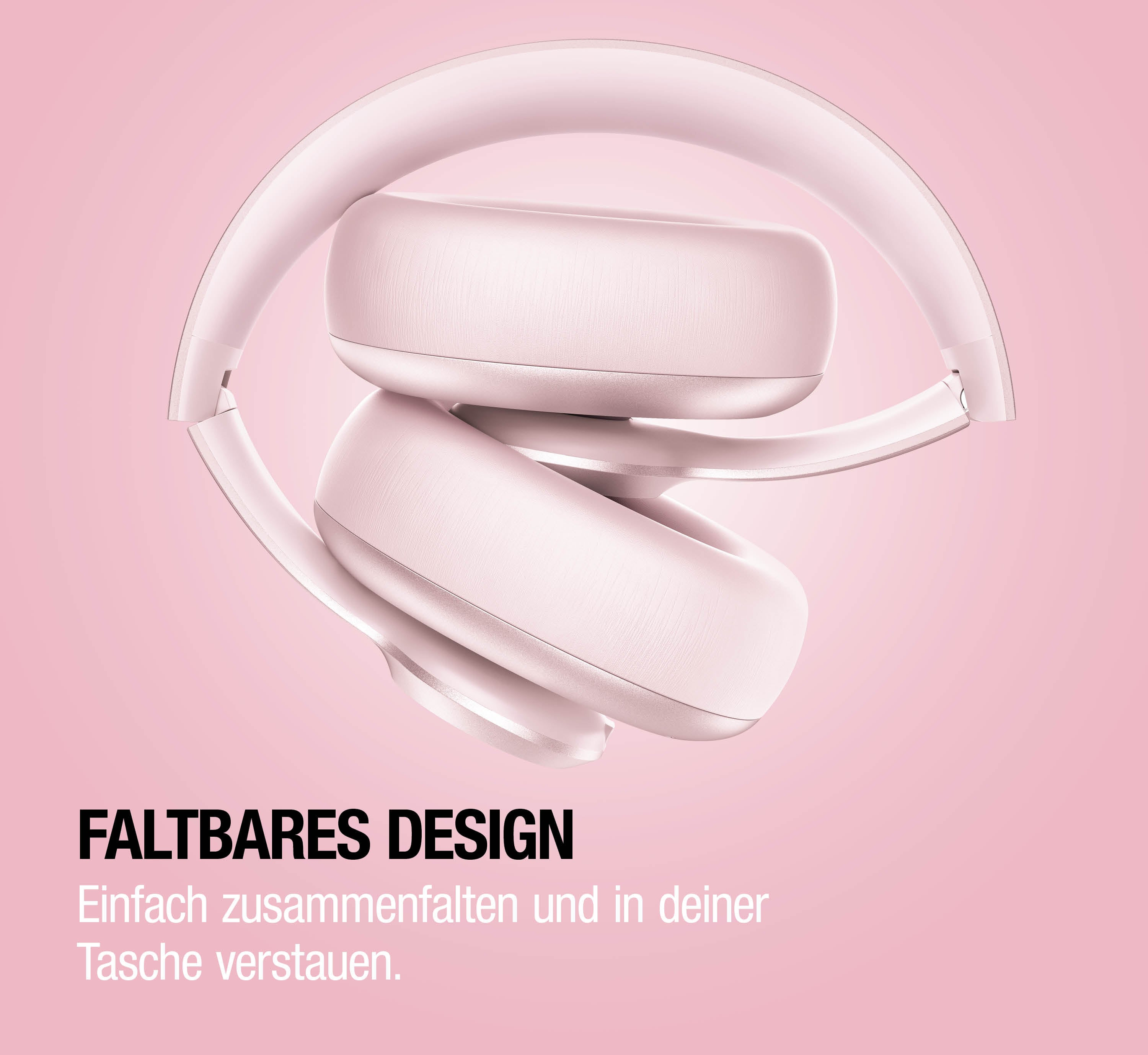 Faltbare, rosafarbene Kopfhörer auf rosa Hintergrund.