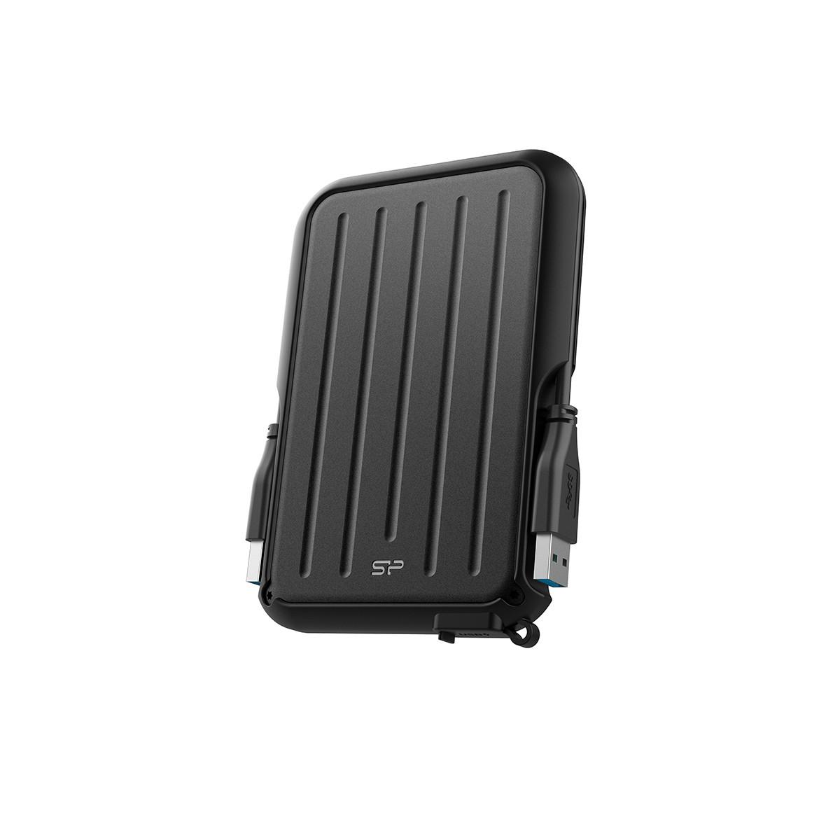 Caja externa de disco duro negra con parte superior acanalada y cables USB conectados.