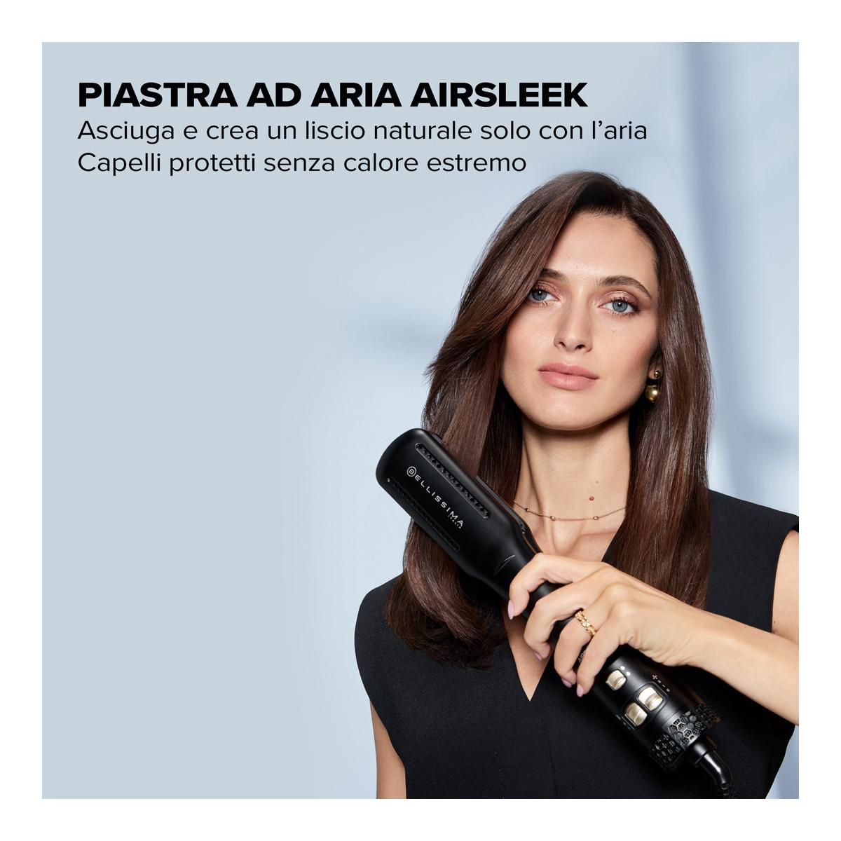 Kobieta trzyma czarną suszarkę do włosów z logo Bellissima.
