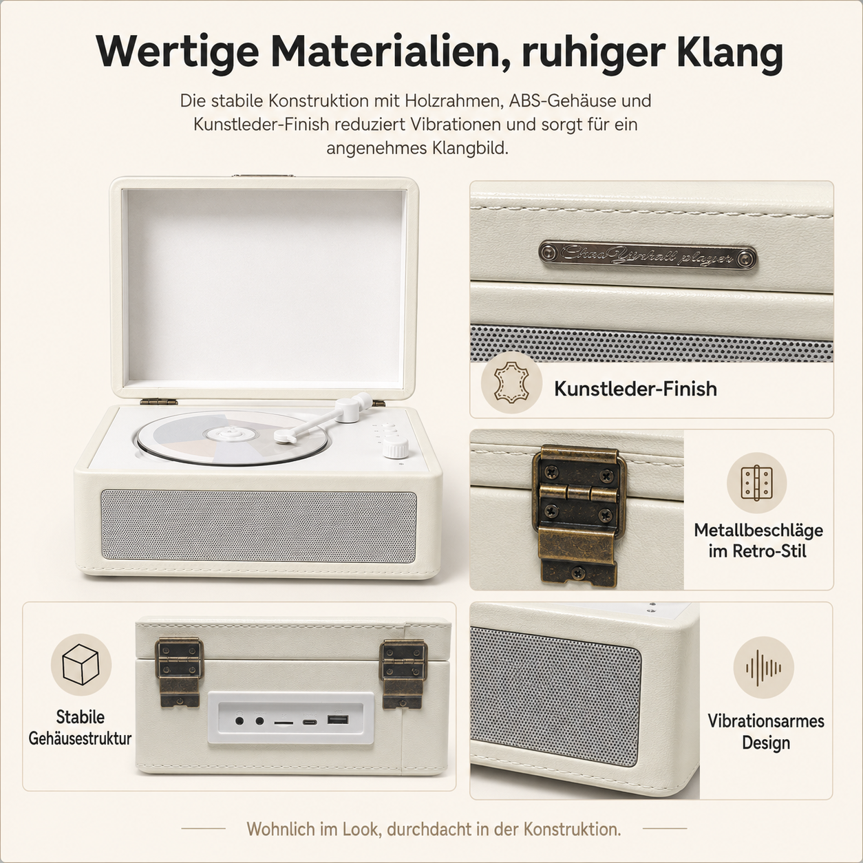 Ein cremefarbener Plattenspieler mit Kunstleder-Finish, Metallbeschlägen und Lautsprechern.