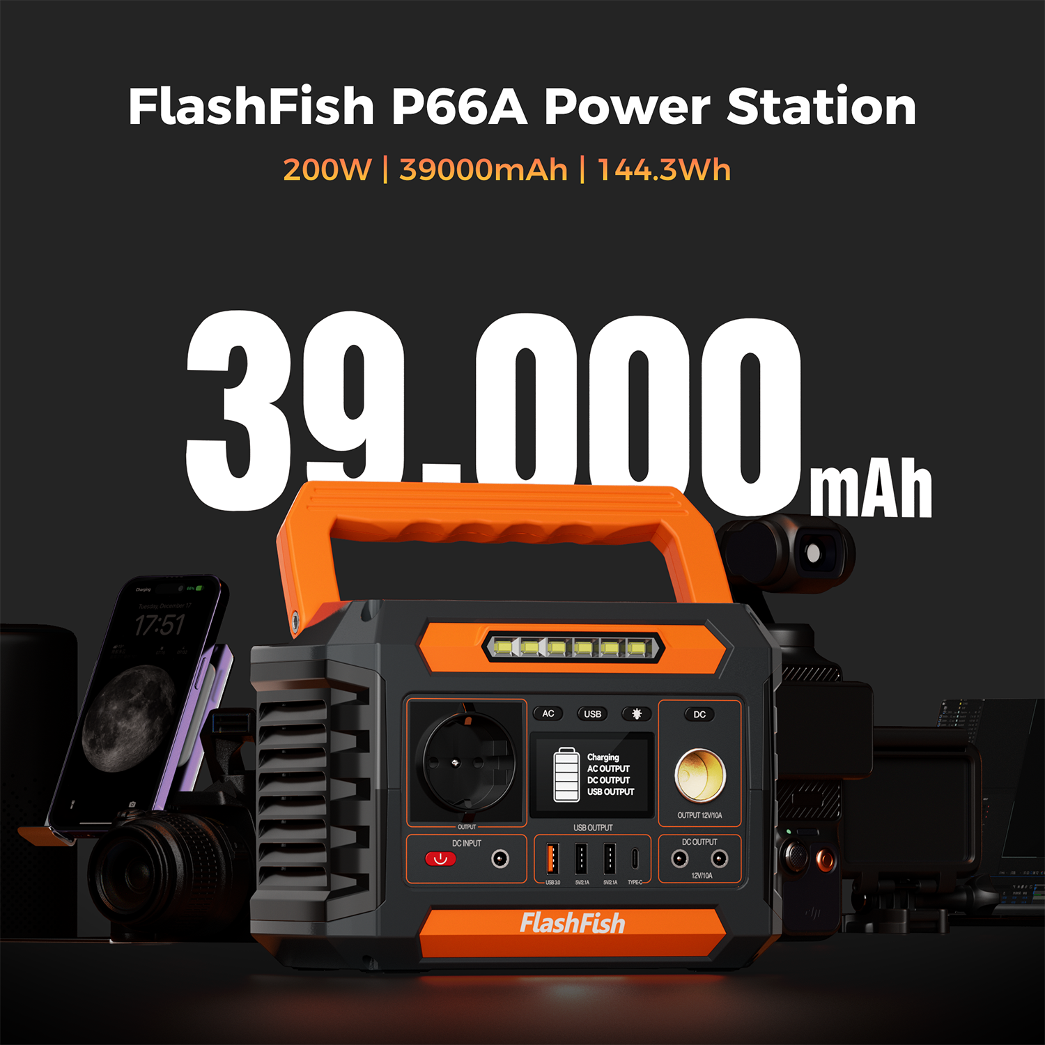 Estación de energía naranja y negra de 39.000 mAh, con teléfono y cámara cerca.