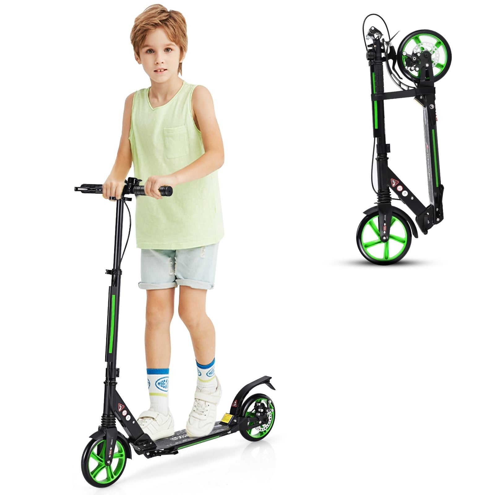 A boy in a light green tank top and denim shorts stands on a black scooter.