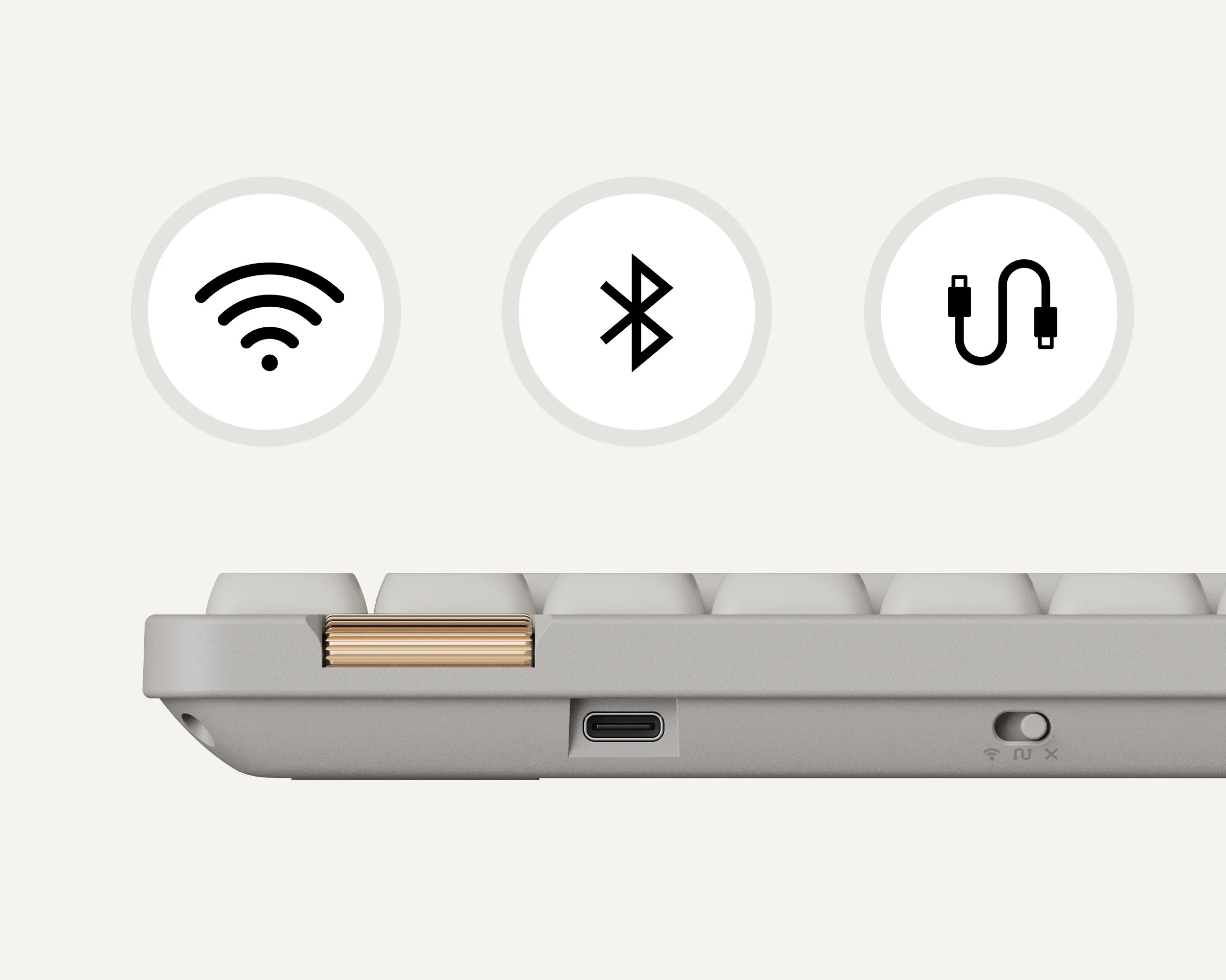 Zbliżenie szarej klawiatury z ikonami Wi-Fi, Bluetooth i USB-C.