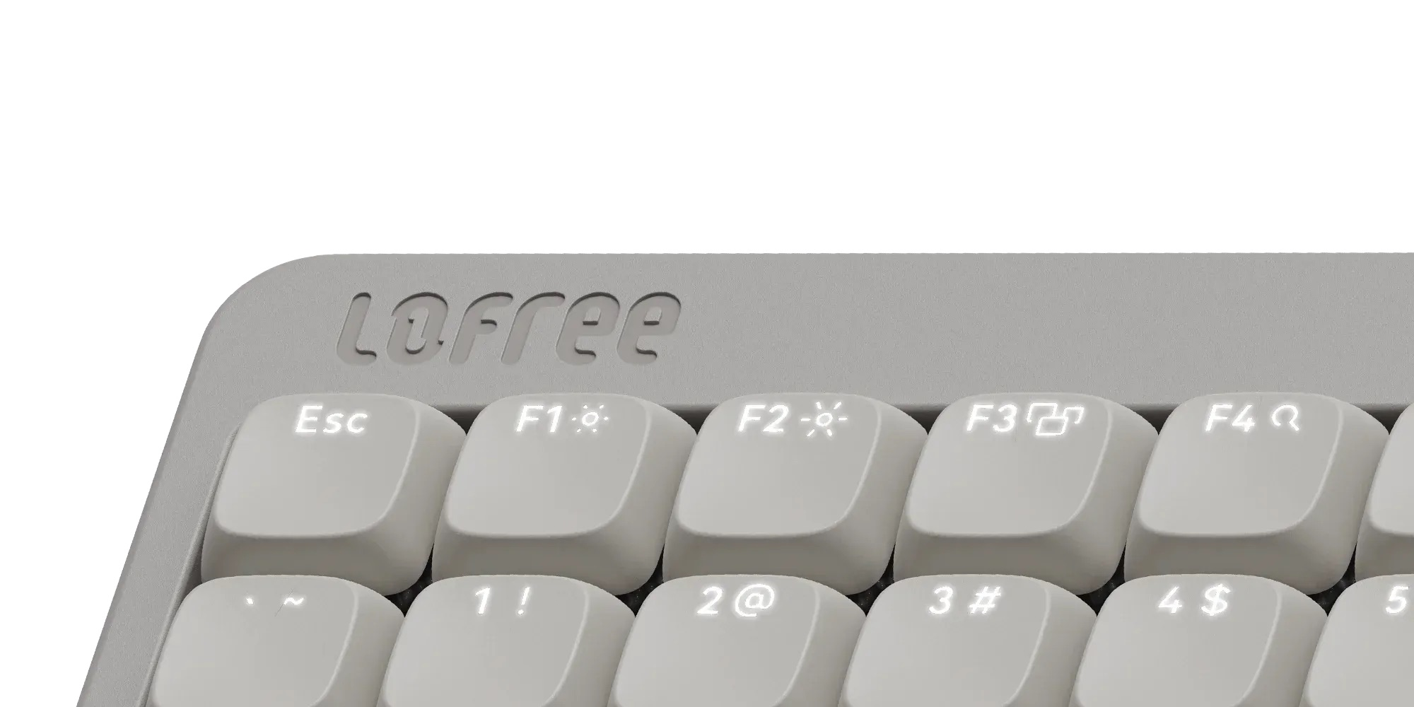 Zbliżenie szarej klawiatury Lofree, pokazujące klawisze Esc, F1-F4 i klawisze numeryczne.