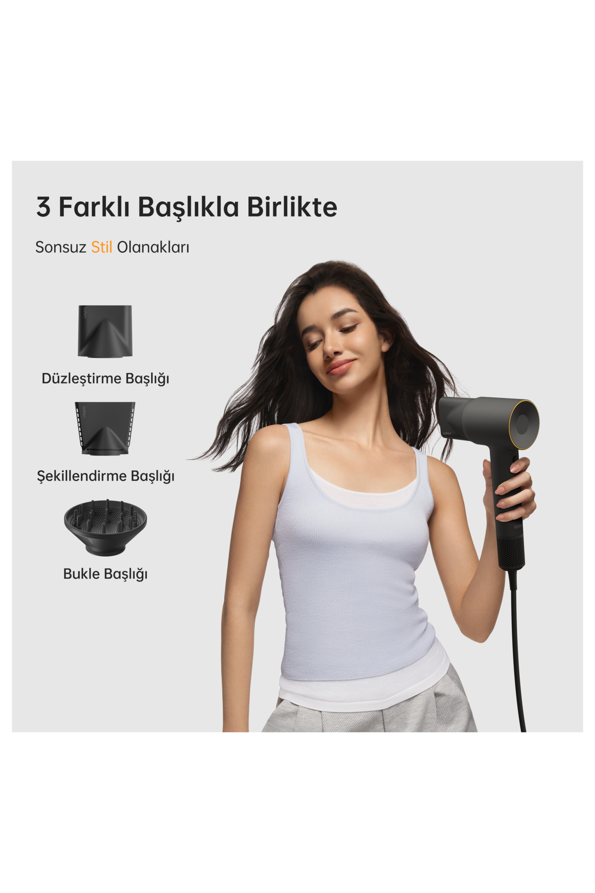 Bir kadın yanında üç başlığı olan koyu renkli bir saç kurutma makinesi tutuyor.