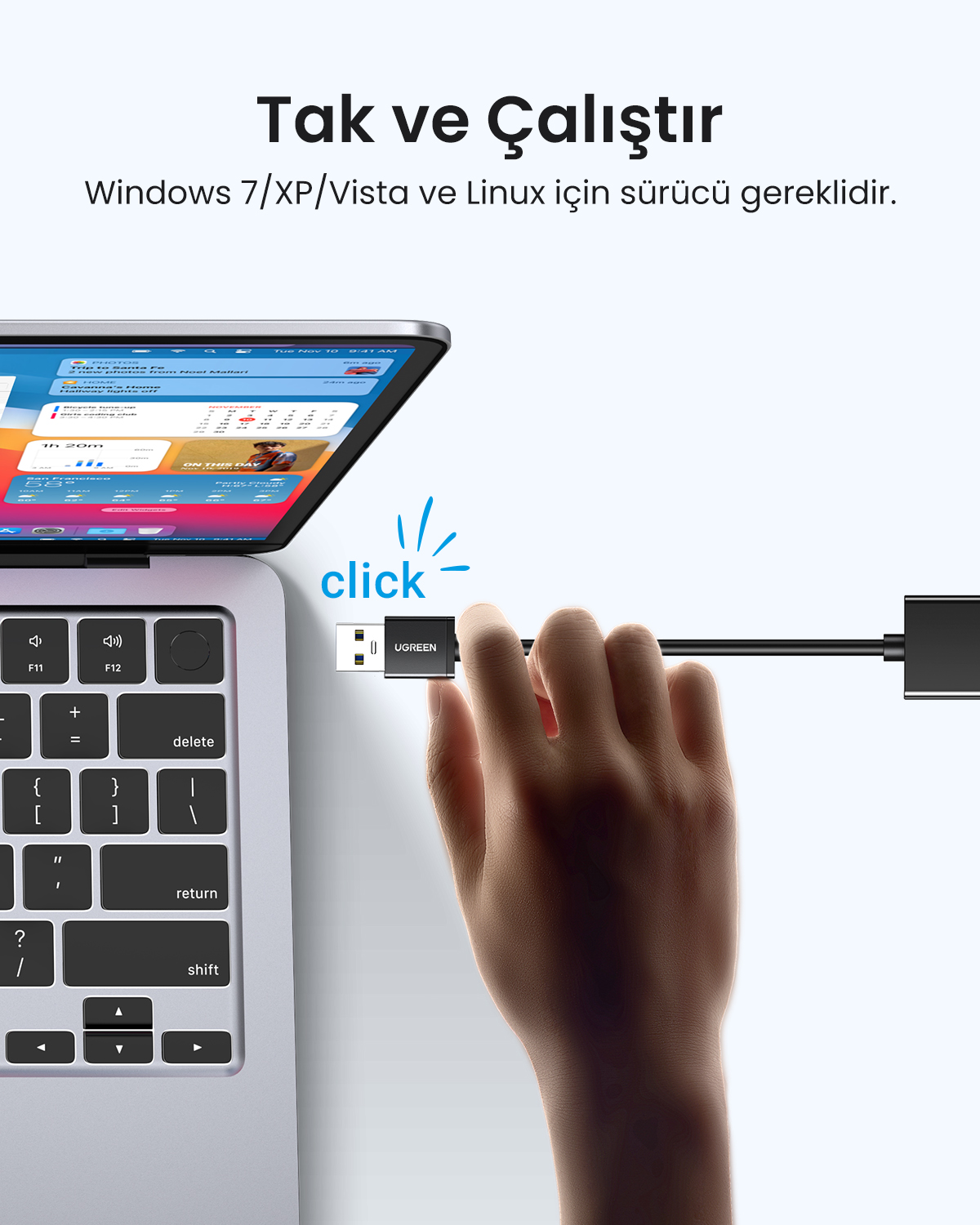 Bir el, Windows/Linux destekli bir dizüstü bilgisayara UGREEN USB aygıtı takıyor.