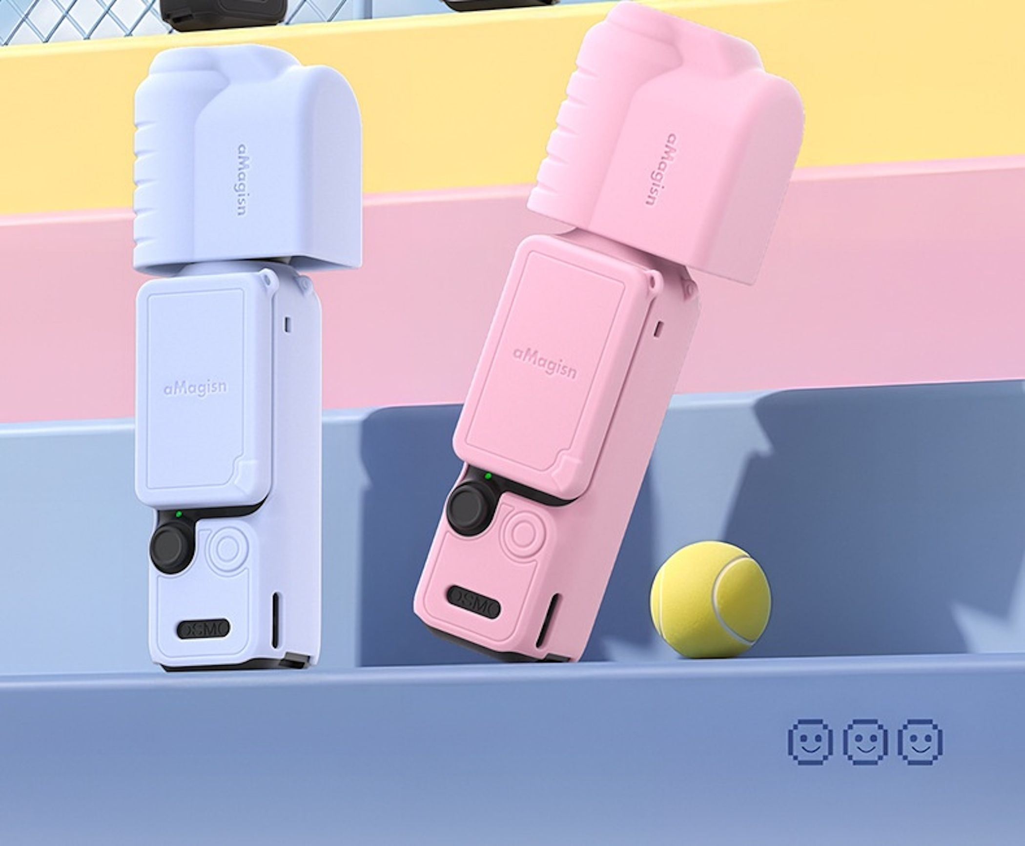 Zwei Kameras, eine blaue und eine rosa, neben einem Tennisball auf blauen und rosa Stufen.