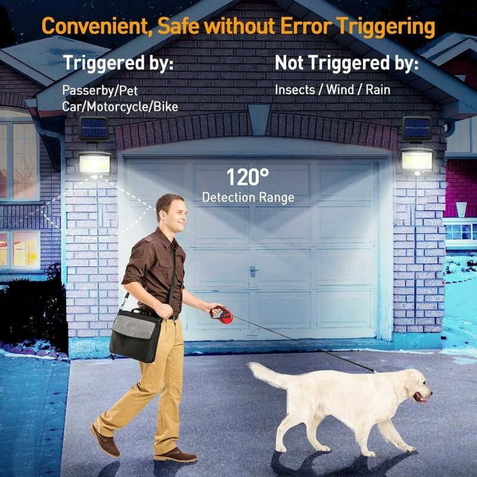 Mann geht mit Hund vor Garage, Solarleuchte ist an.