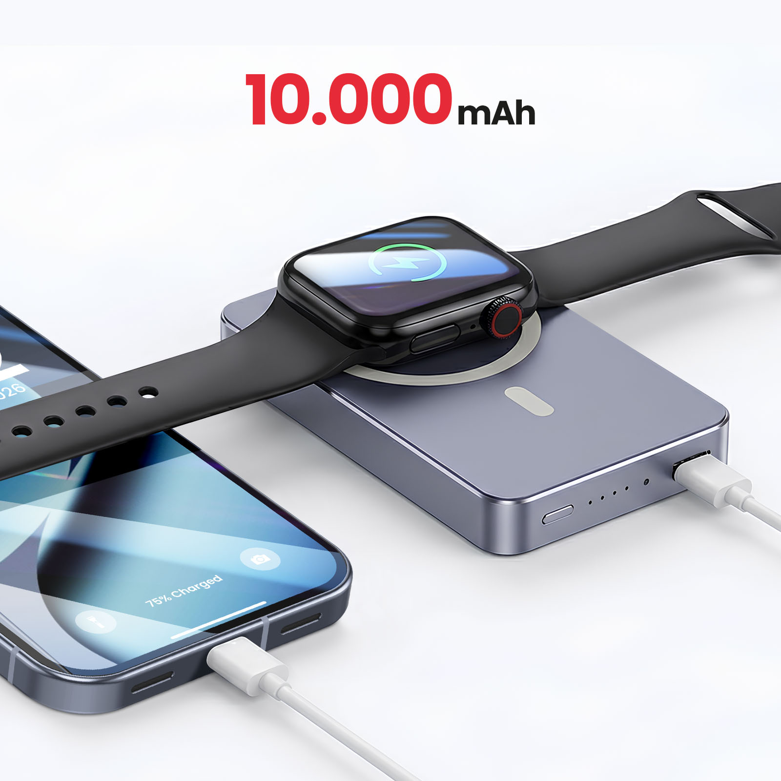 Un power bank grigio carica un telefono e uno smartwatch.