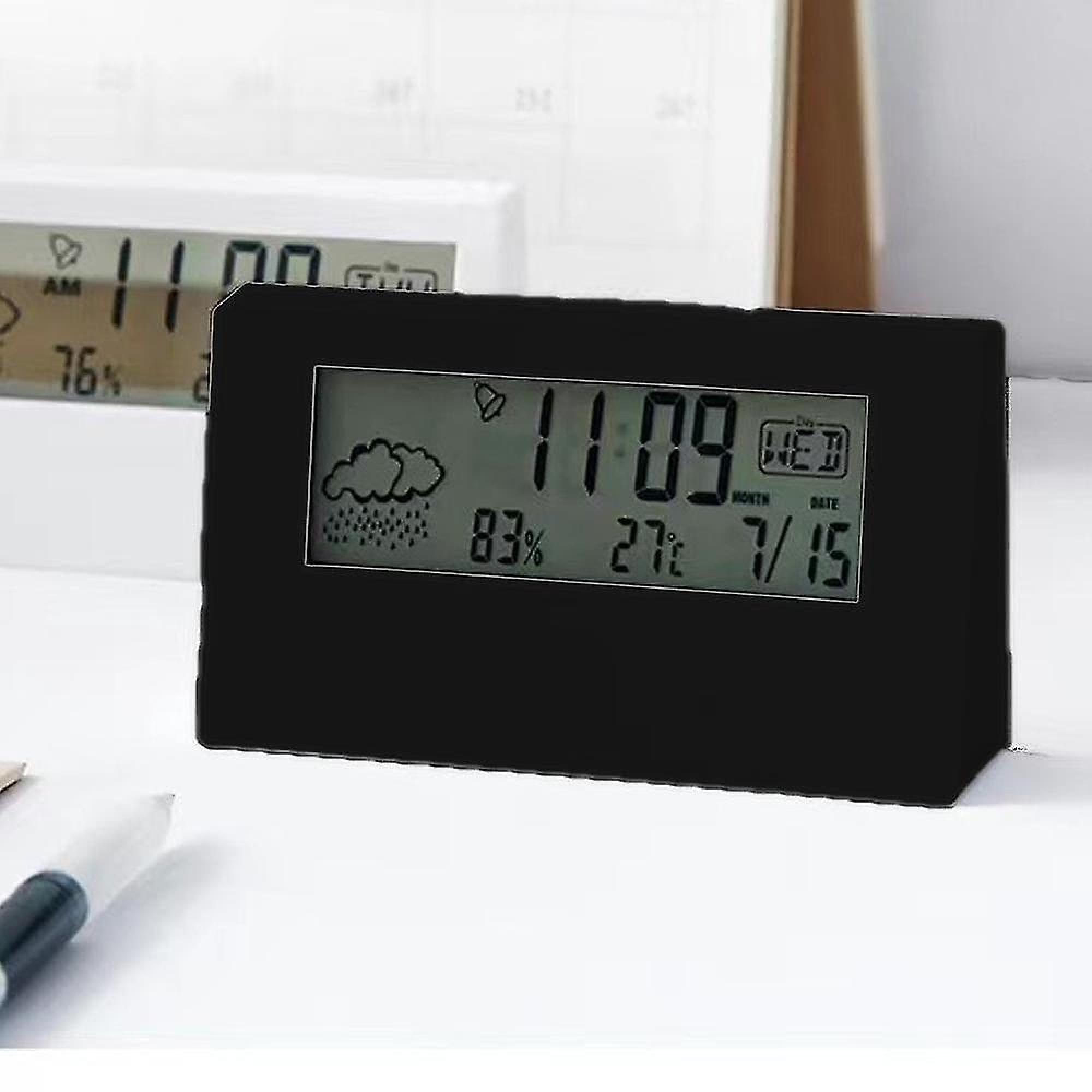 Ein schwarzer Digitalwecker zeigt 11:09 Uhr, 83% Luftfeuchtigkeit, 27°C und Mittwoch, 15. Juli.