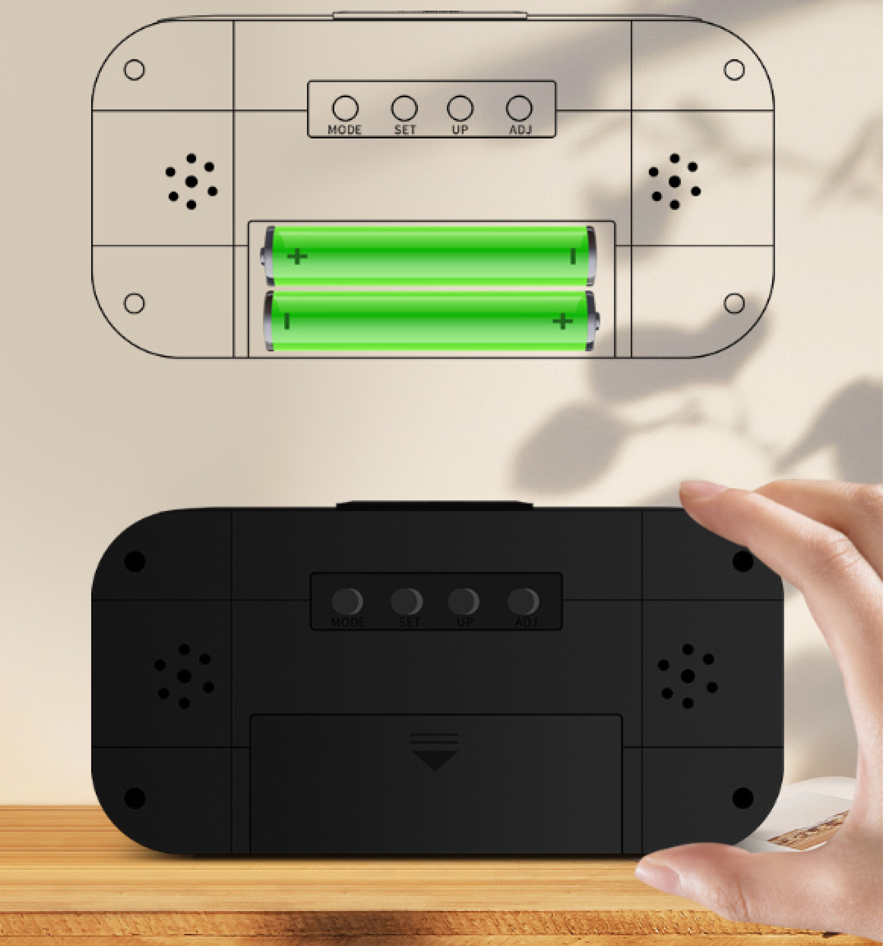 Ein schwarzer Digitalwecker von hinten mit Batteriefach und Tasten.