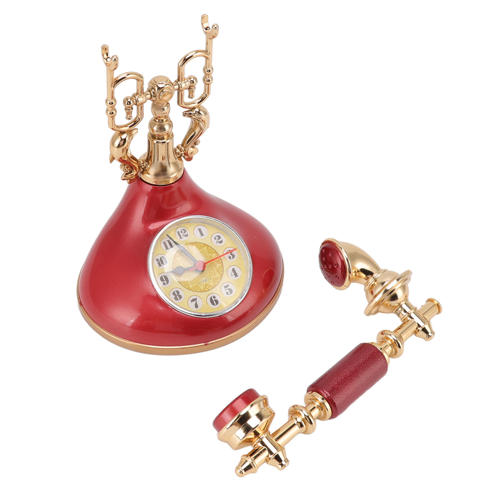 Ein rotes Vintage-Telefon mit goldener Verzierung und einem separaten Hörer.