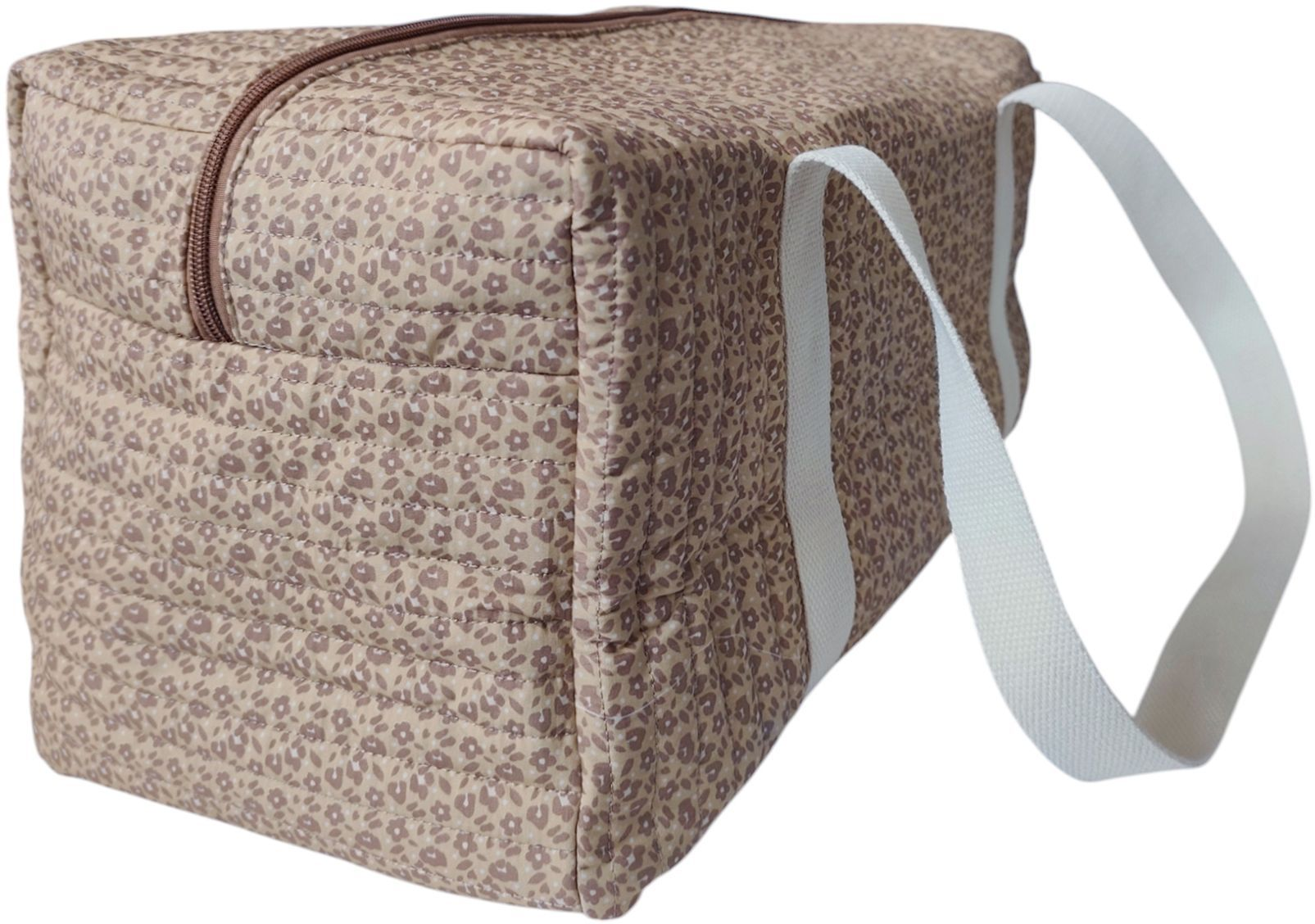 Eine gesteppte Tasche mit Blumenmuster und weißen Tragegriffen.