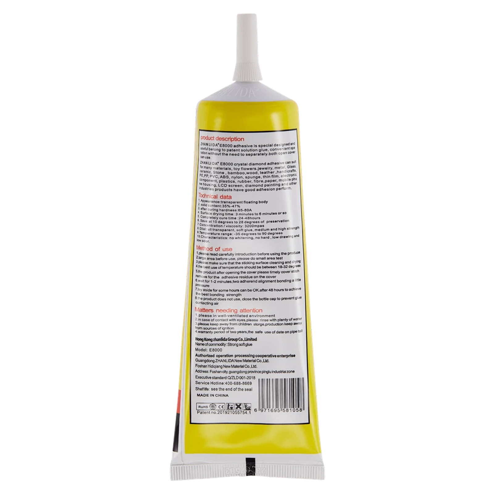 Tubo giallo di adesivo con tappo ed etichetta bianchi.