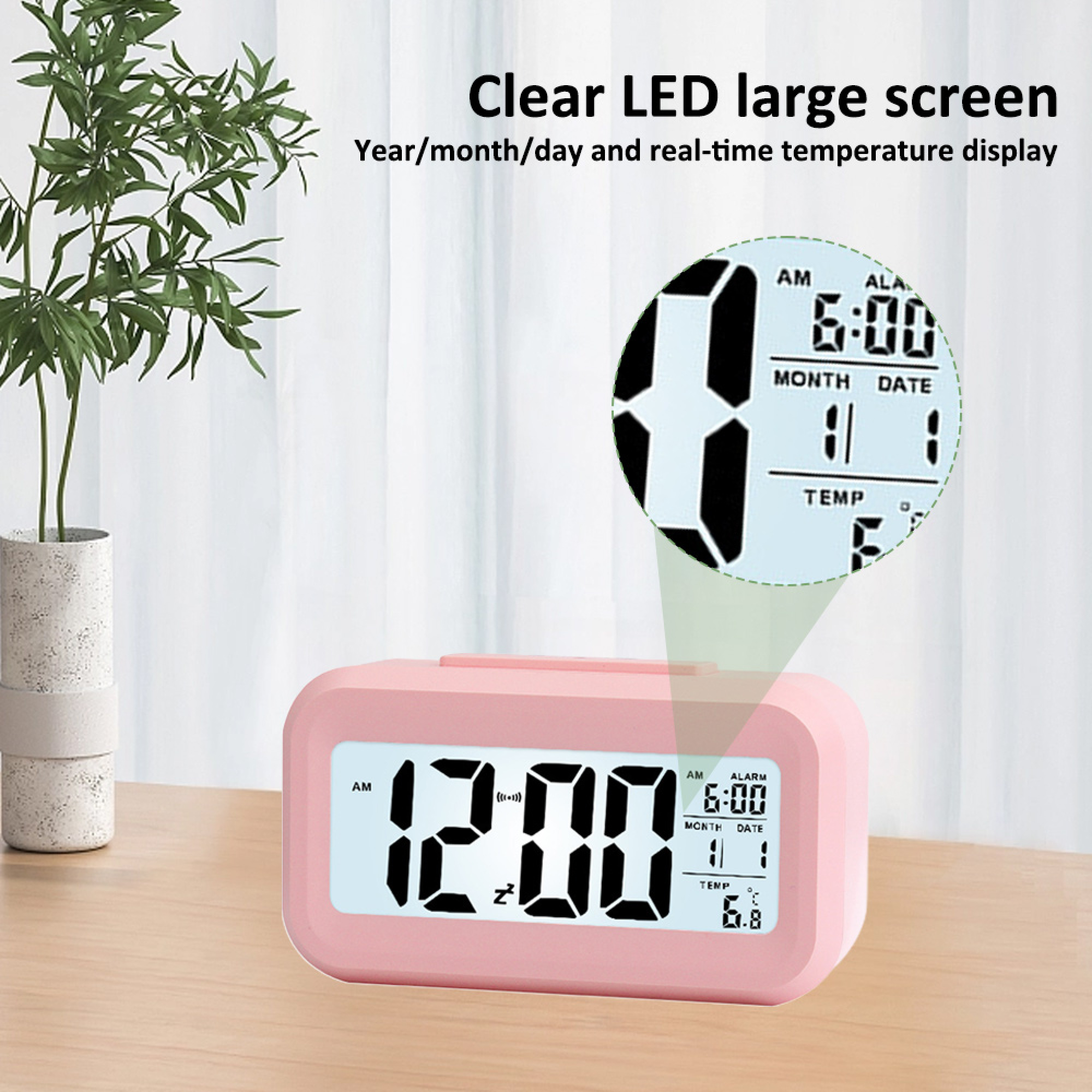 Ein rosa Digitalwecker zeigt 12:00 Uhr und 6:00 Uhr Alarmzeit an.